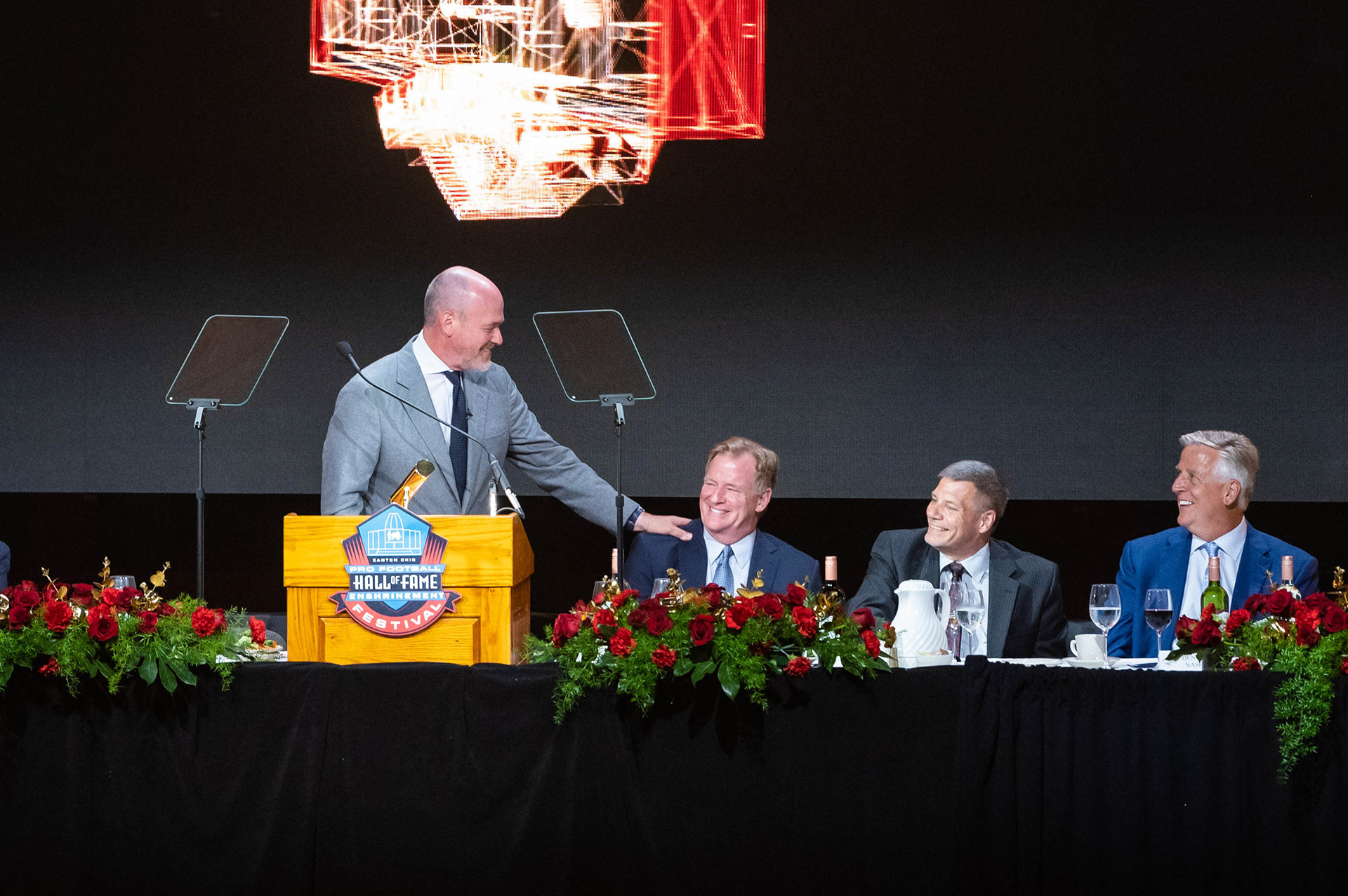 Rich Eisen and Roger Goodell telling jokes to each other