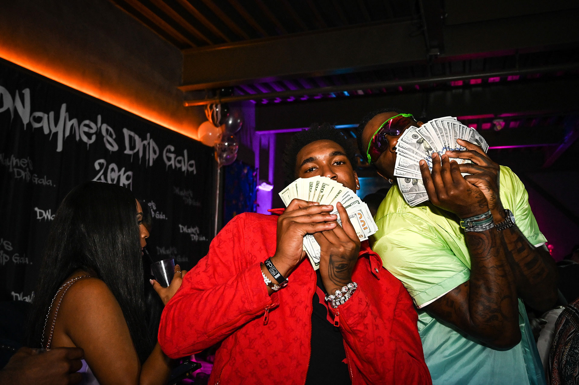 Malik Monk and Dwayne Bacon showing a wad of money