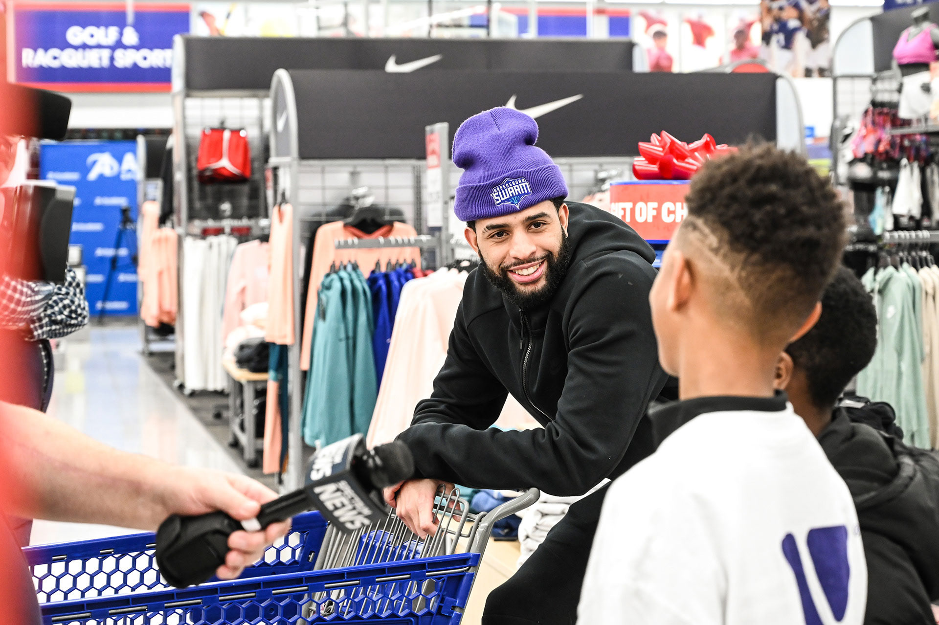 Swarm players taking YMCA kids shopping during Christmas