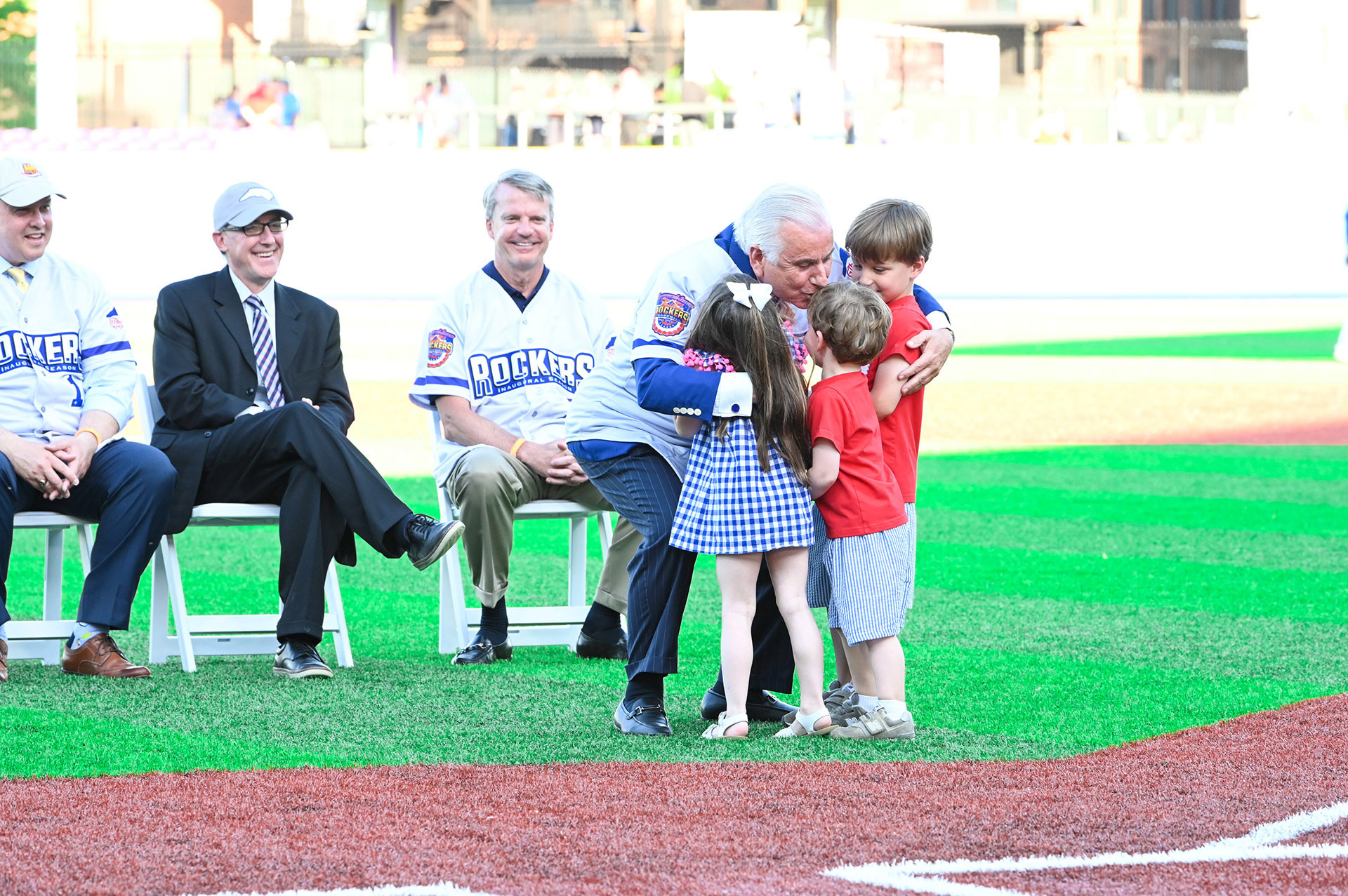 High Point University president greeting his grandchildren