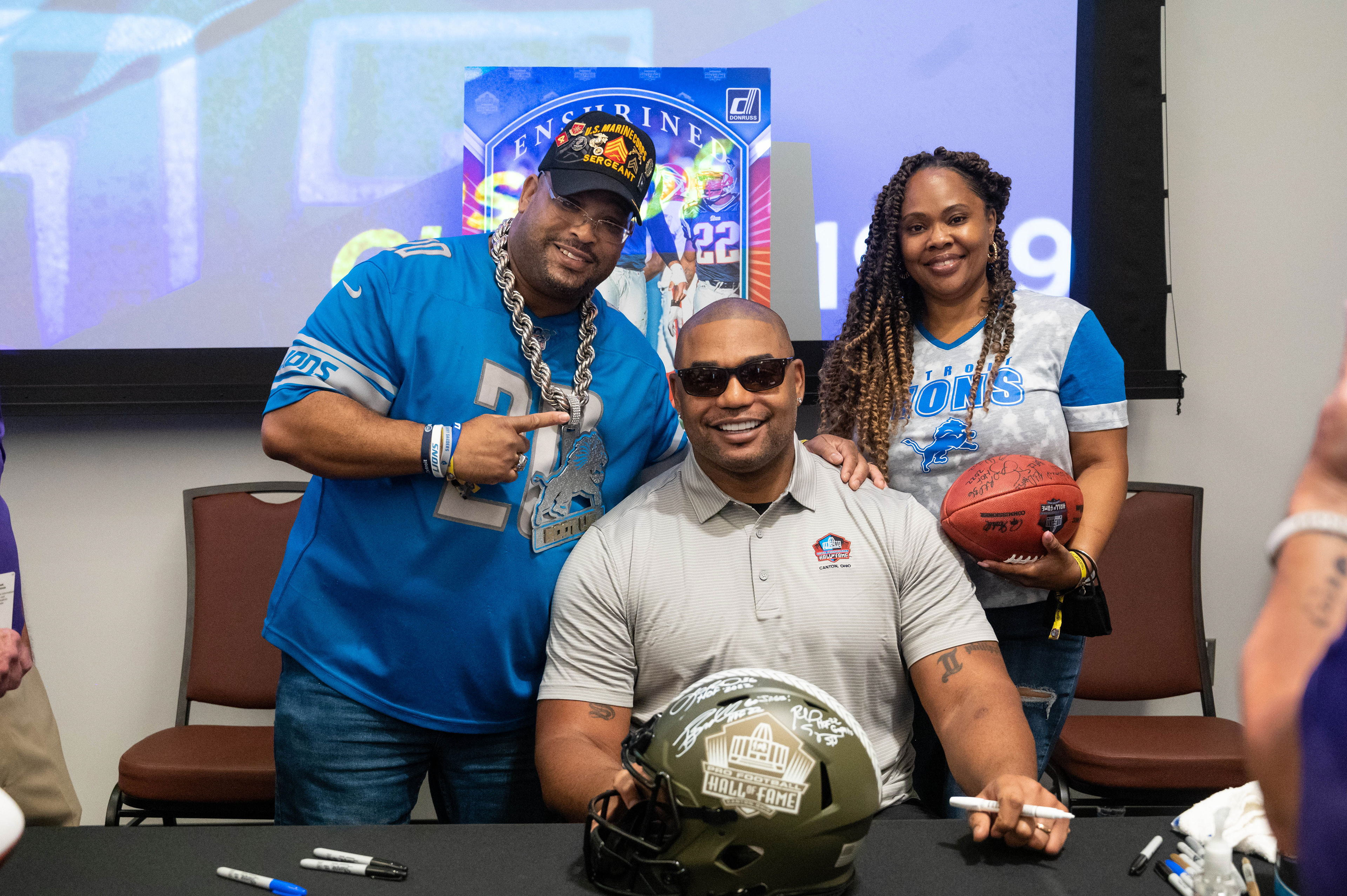 Detroit Lions fans posing with one of the newest members