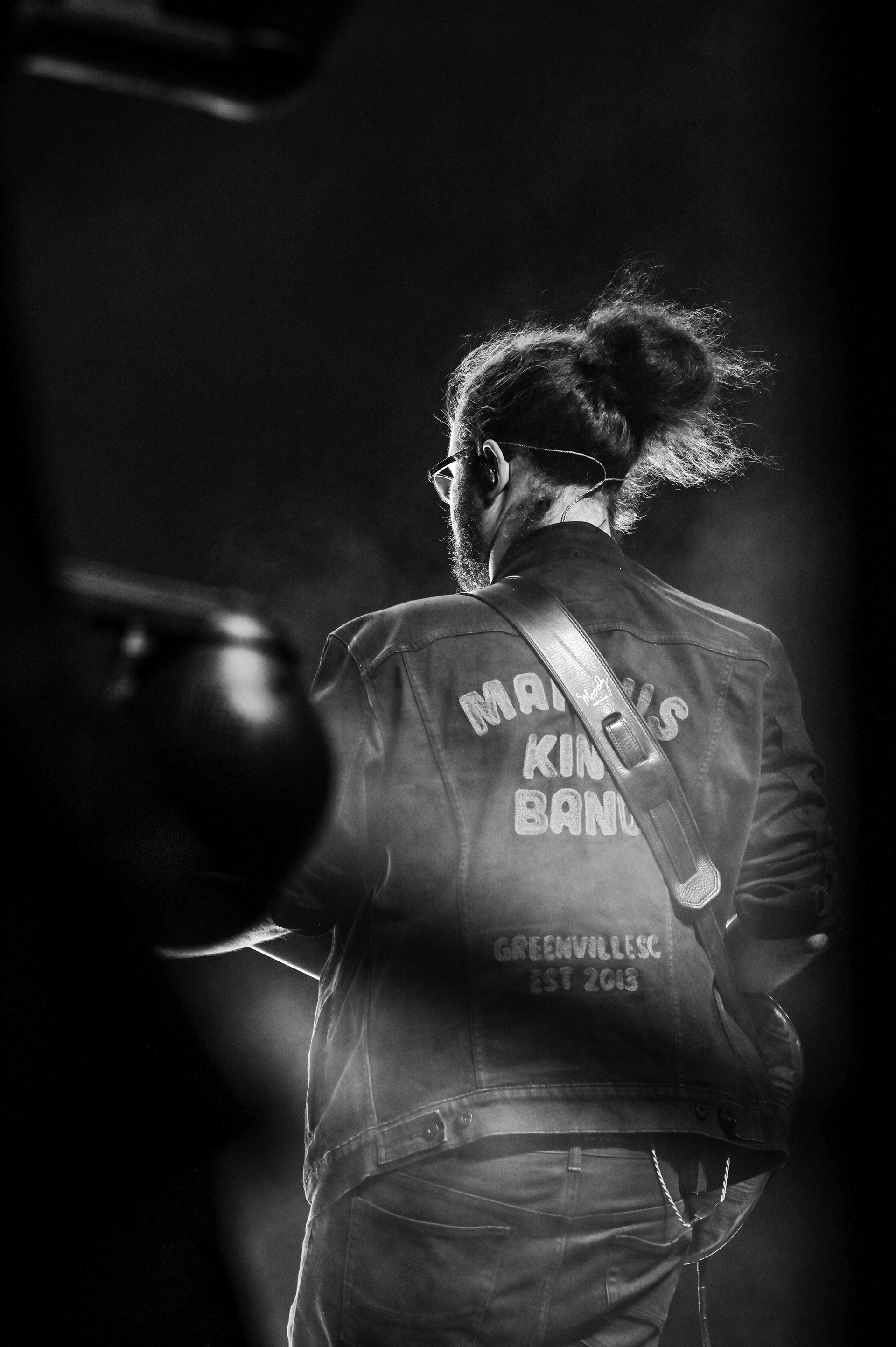 A member of the Marcus King Band performing