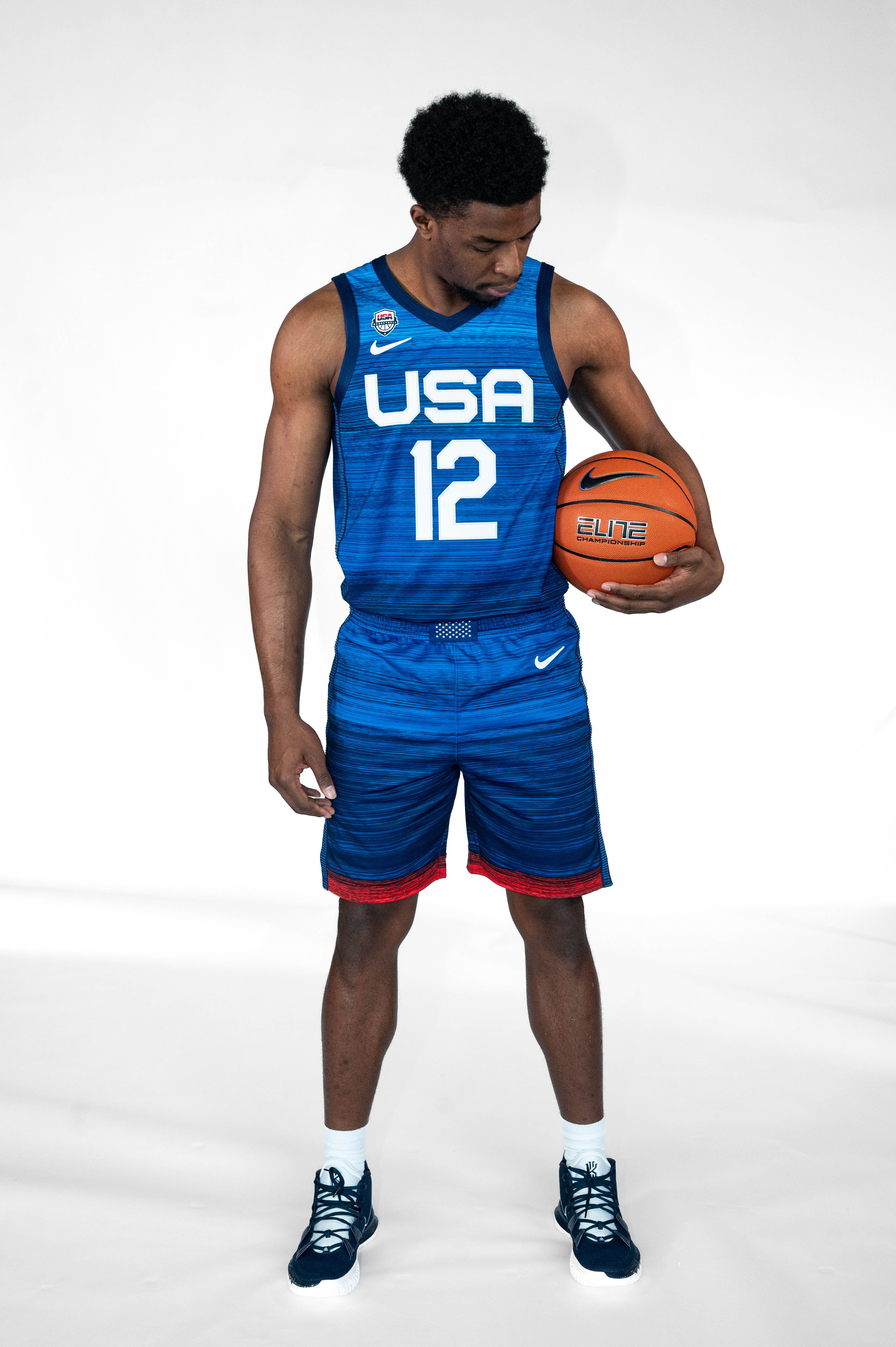 Player looking down at a basketball