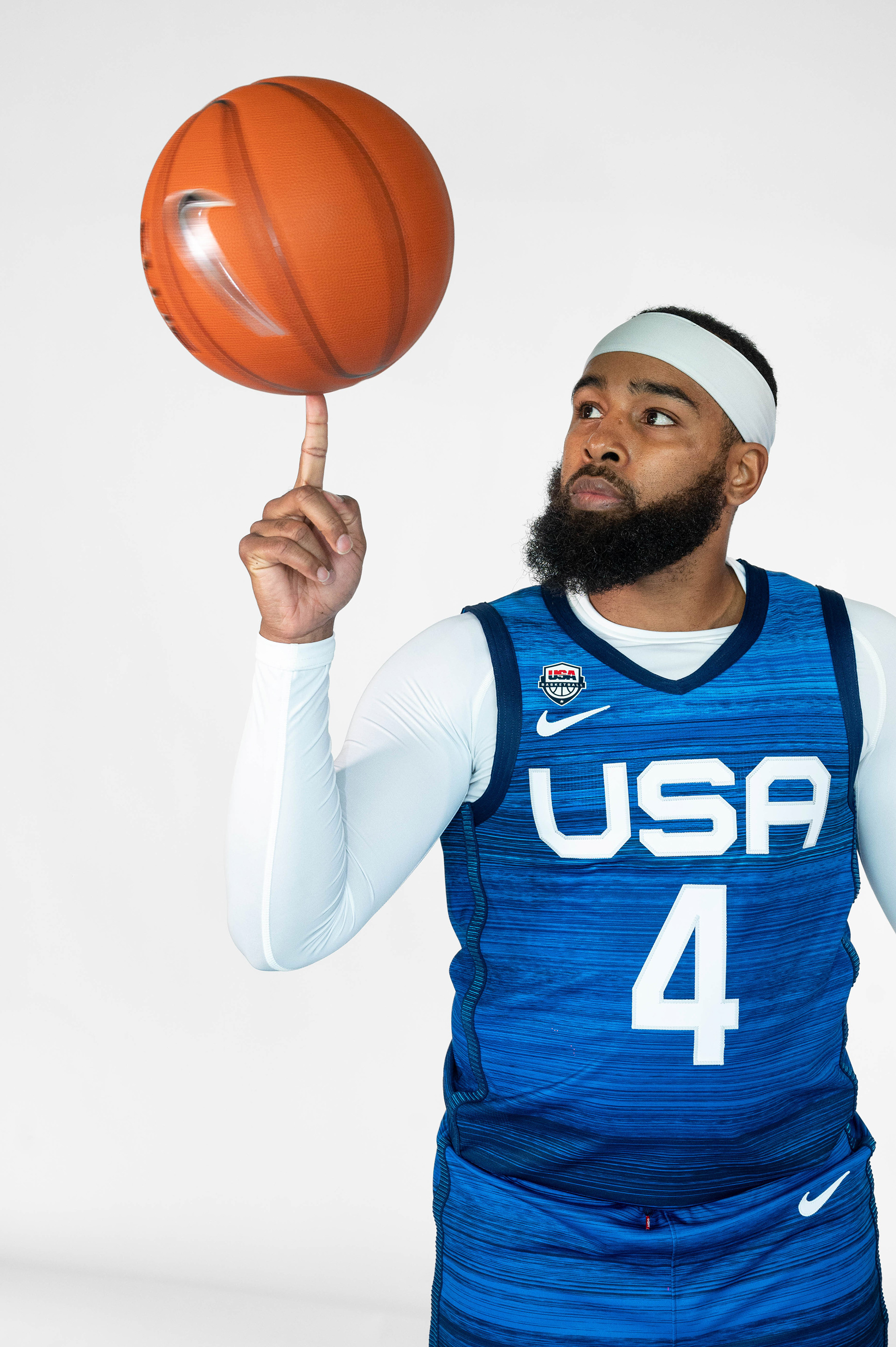Male player balancing a ball on his pointer finger