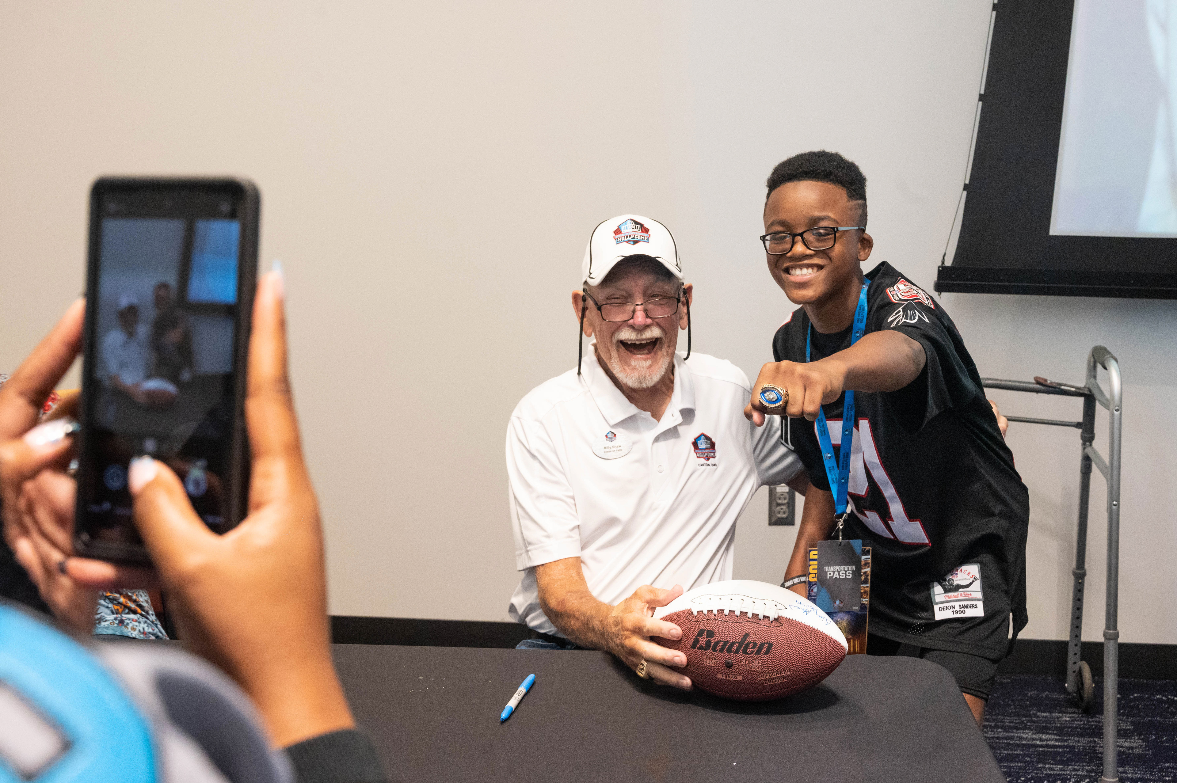 Young kid wearing a Super Bowl ring