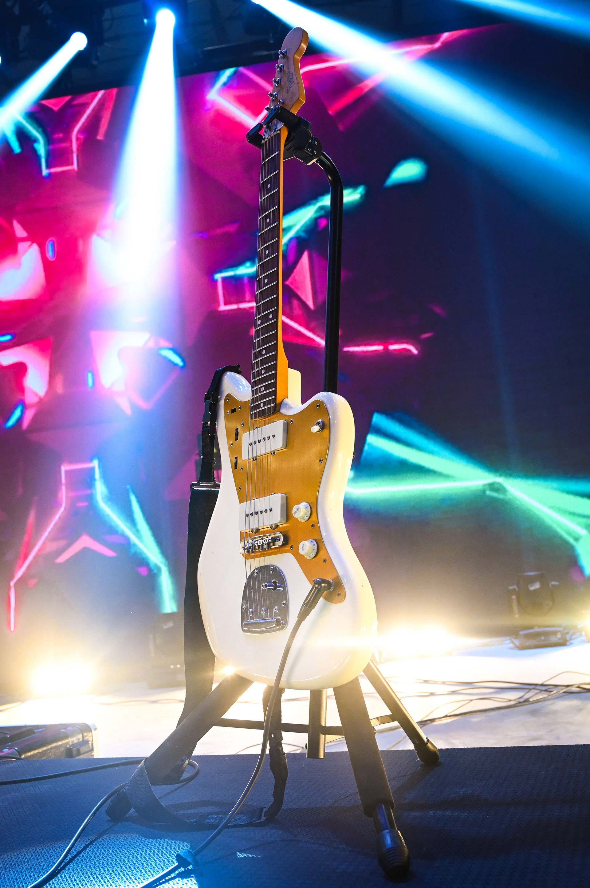 Close up of a guitar on a stand