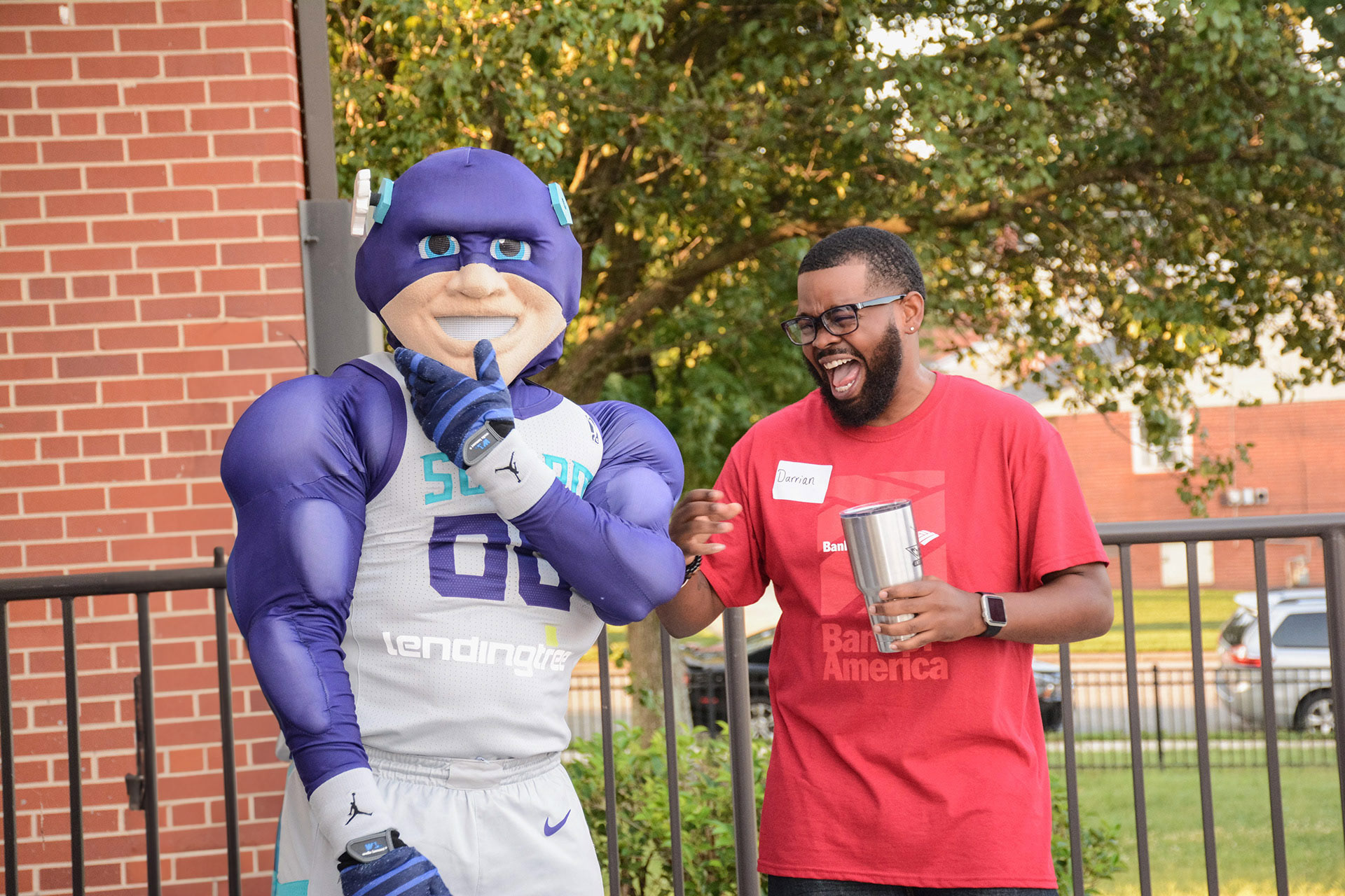 Community event with Swarm mascot and Bank of America employees