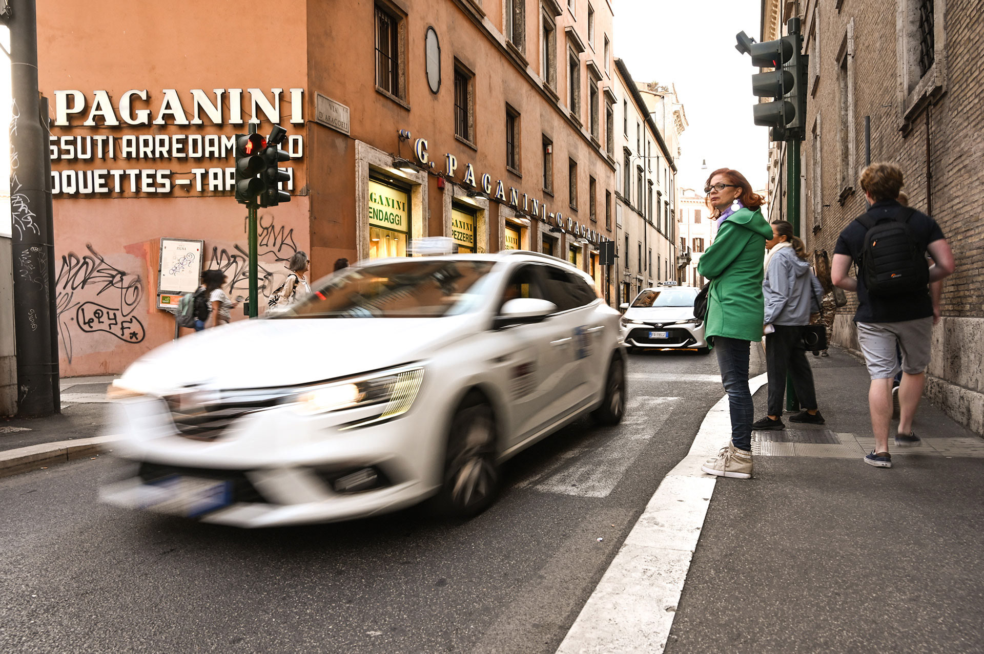 Car speeding by in Italy