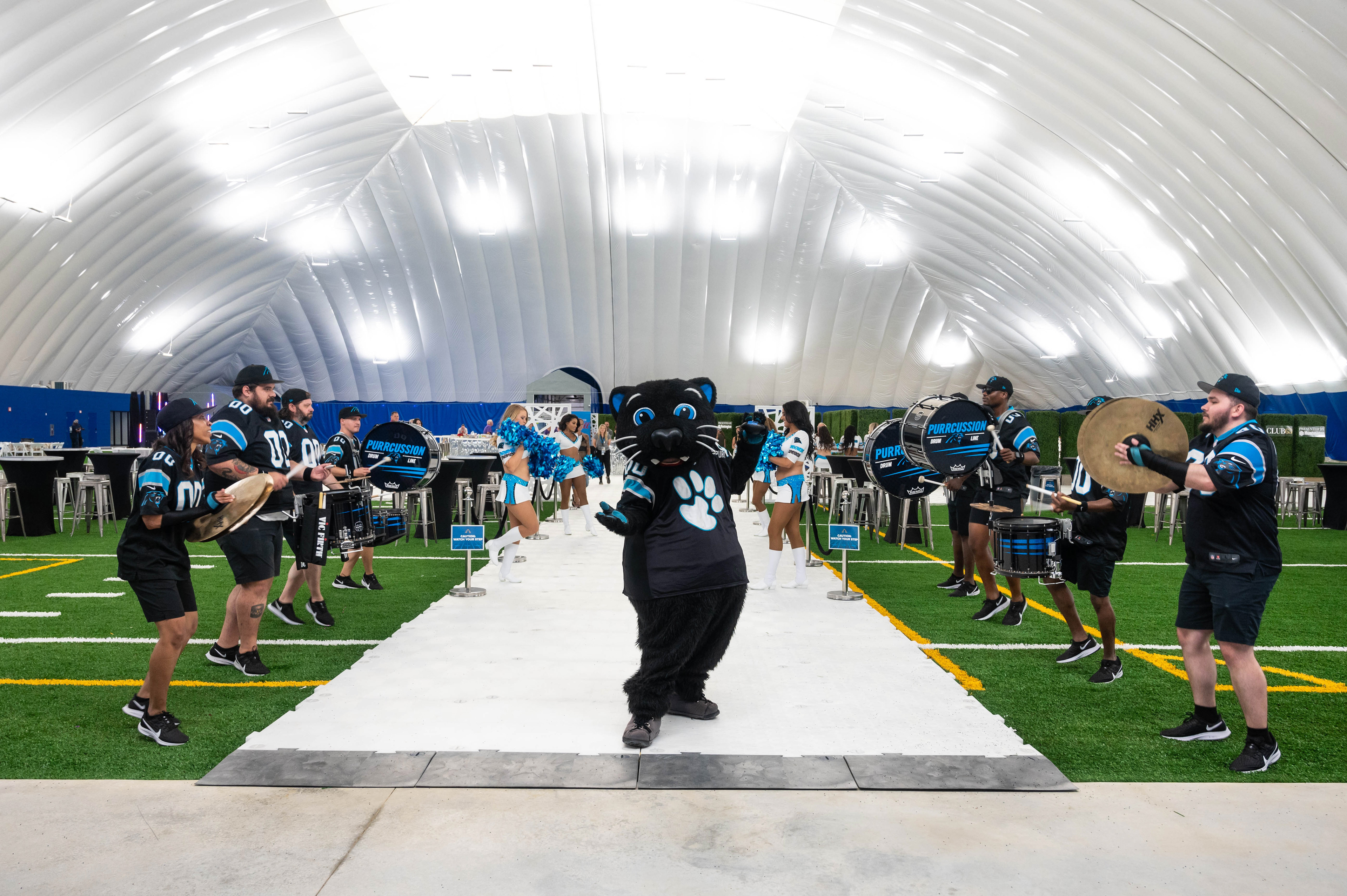 Sir Purr and the Panthers drum line greeting VIP guests