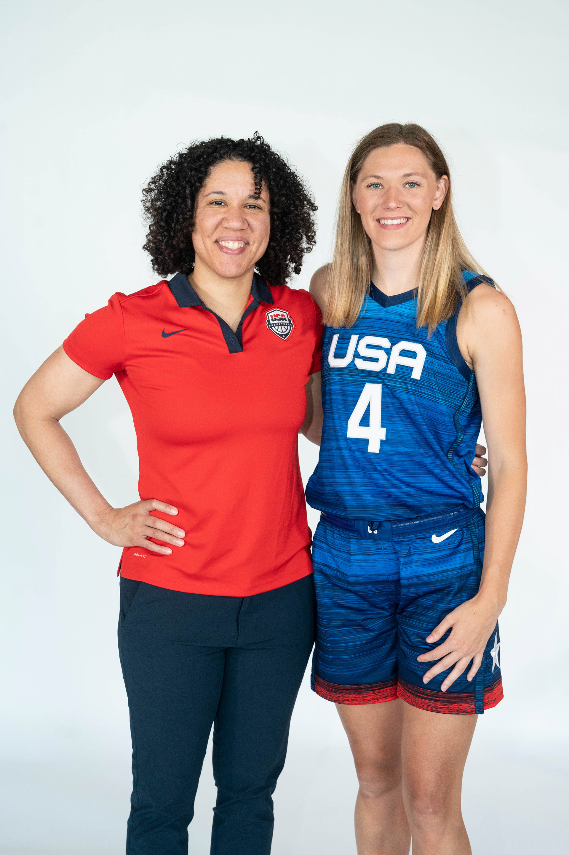 Player and coach posing together