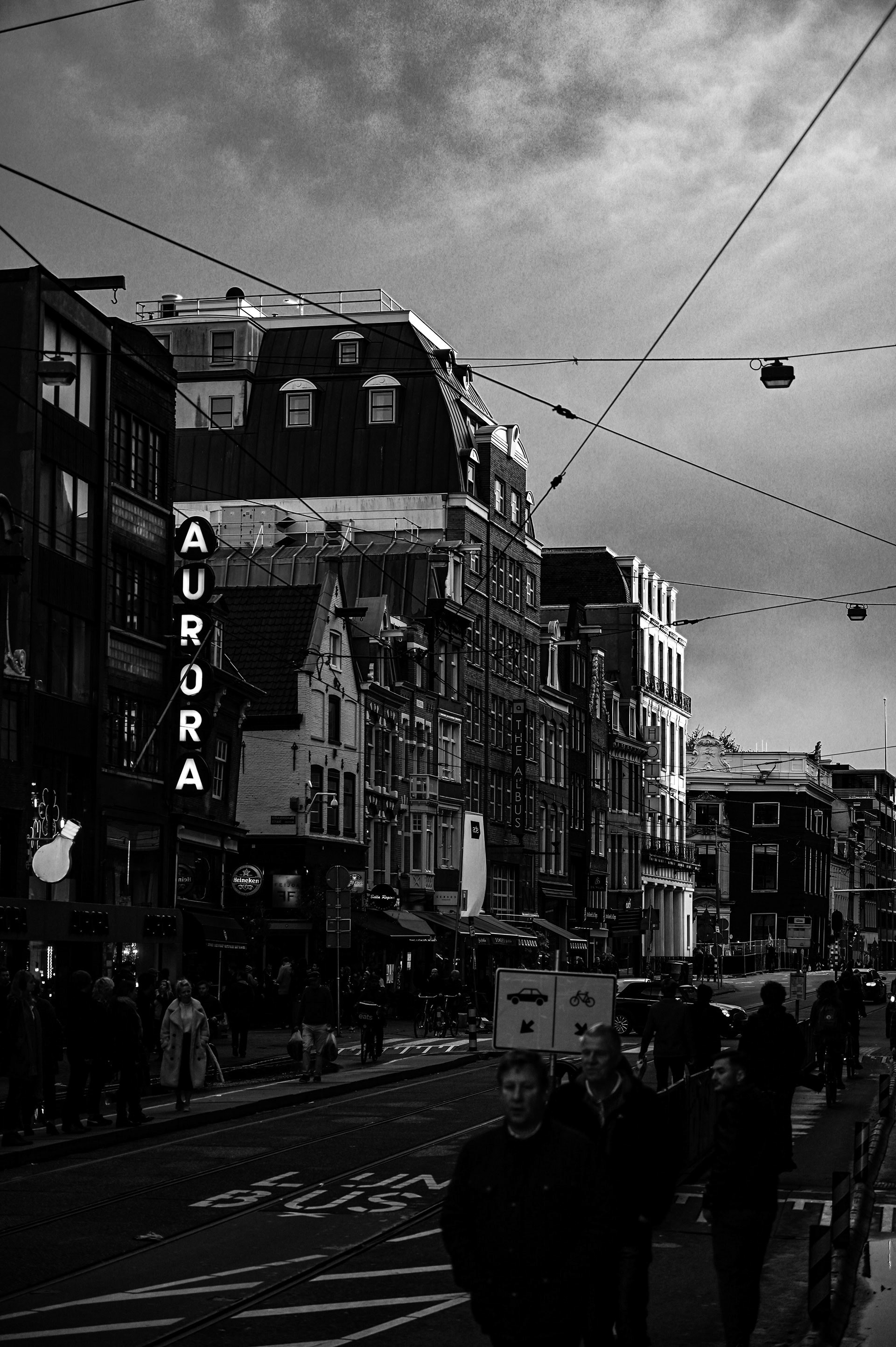 Busy street corner with people passing by