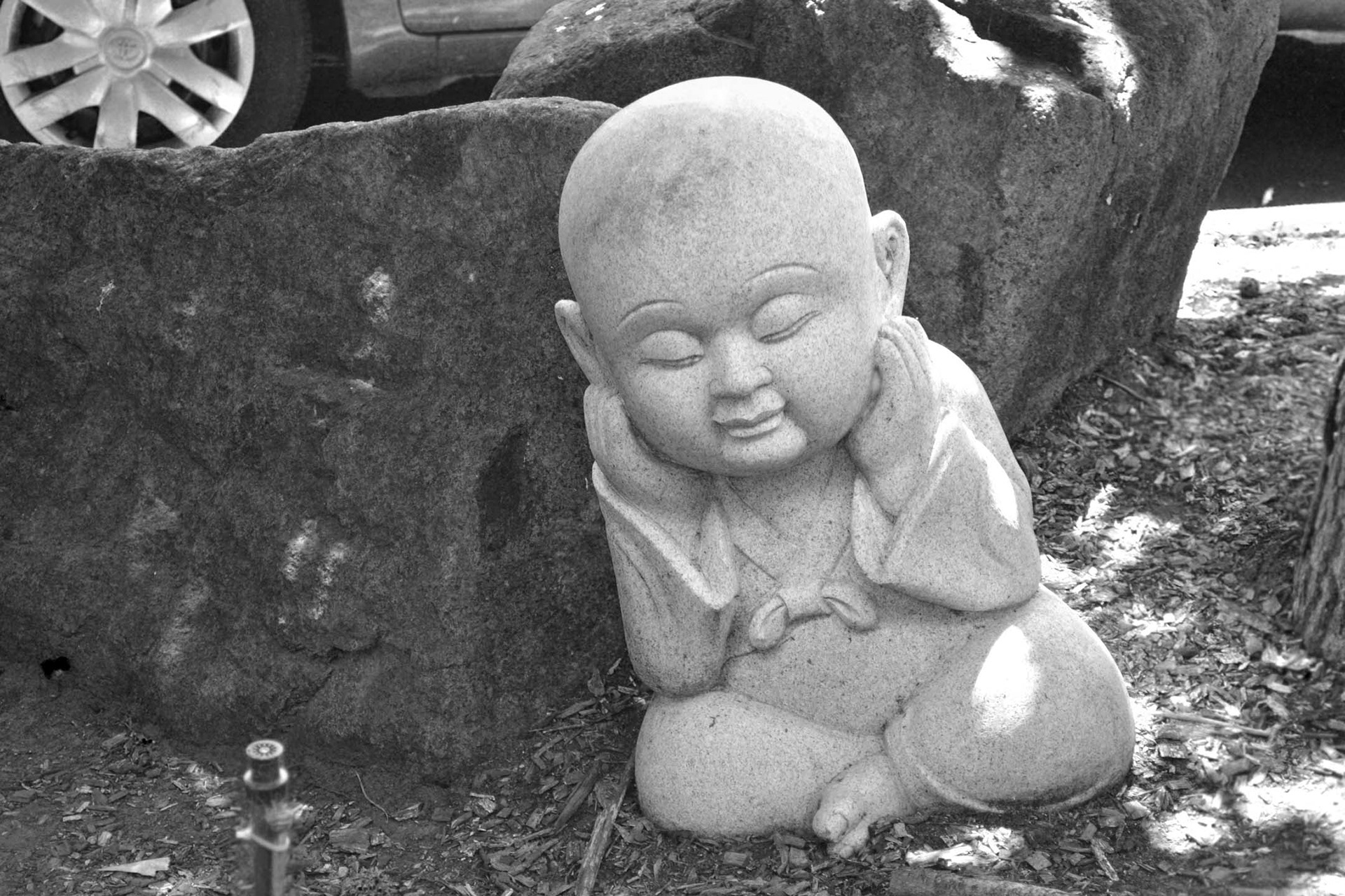 I found this intriguing statue in the garden of the same temple as the Buddha statue. I think there's a hidden meaning in the statue - just not sure what it might be...