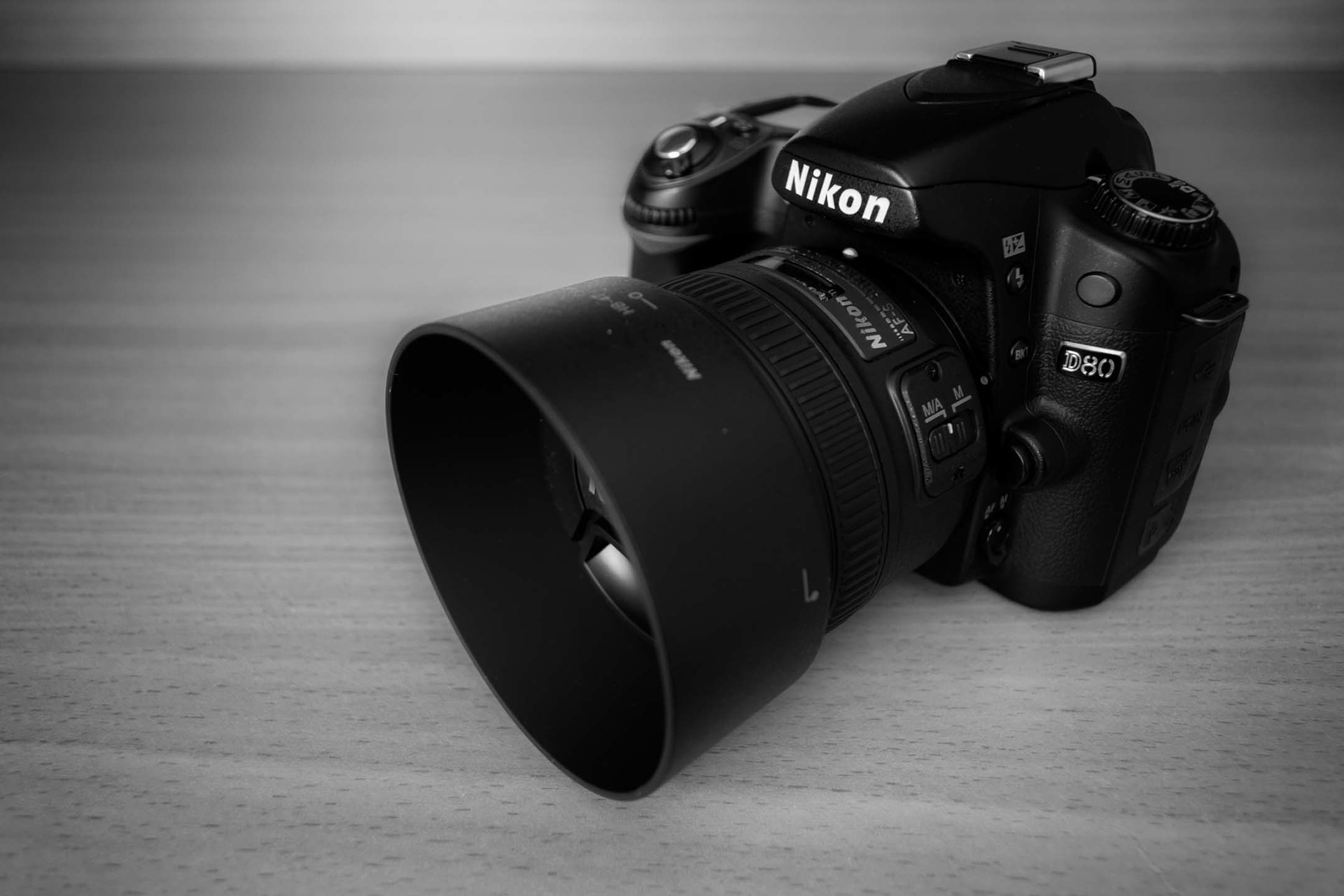 I got a new lens! And it's amazing! Here's a shot I took (with my dad's D3100) of my new NIKKOR 50mm f/1.8 G mounted on my D80. Below are a couple of test shots I took with the new lens.