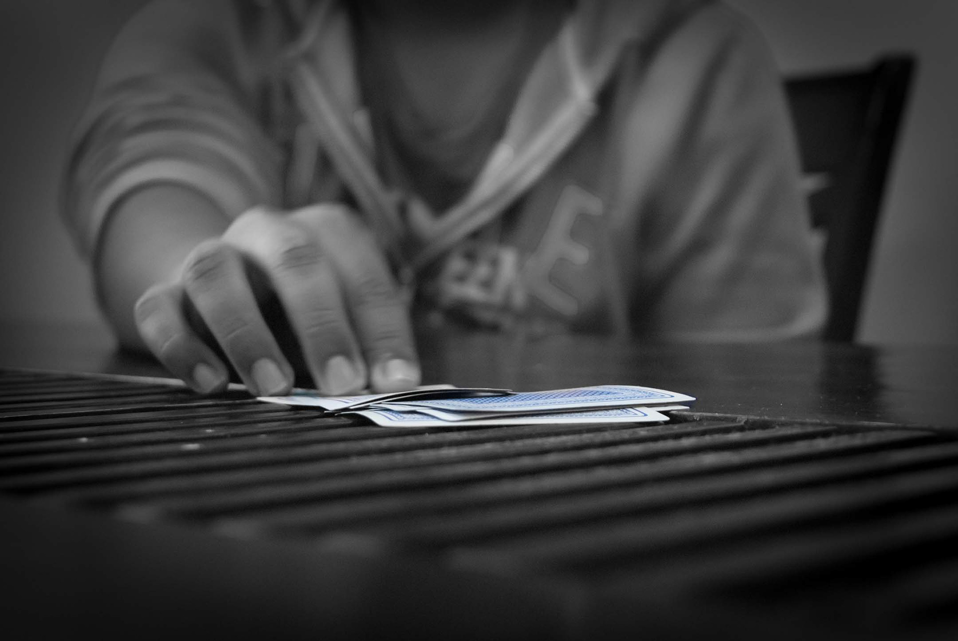 Have you played the card game Bullshit (aka Cheat, Liar, I doubt it etc)? Here's a photo I took of my friend calling his round of cards while we were playing Bullshit.