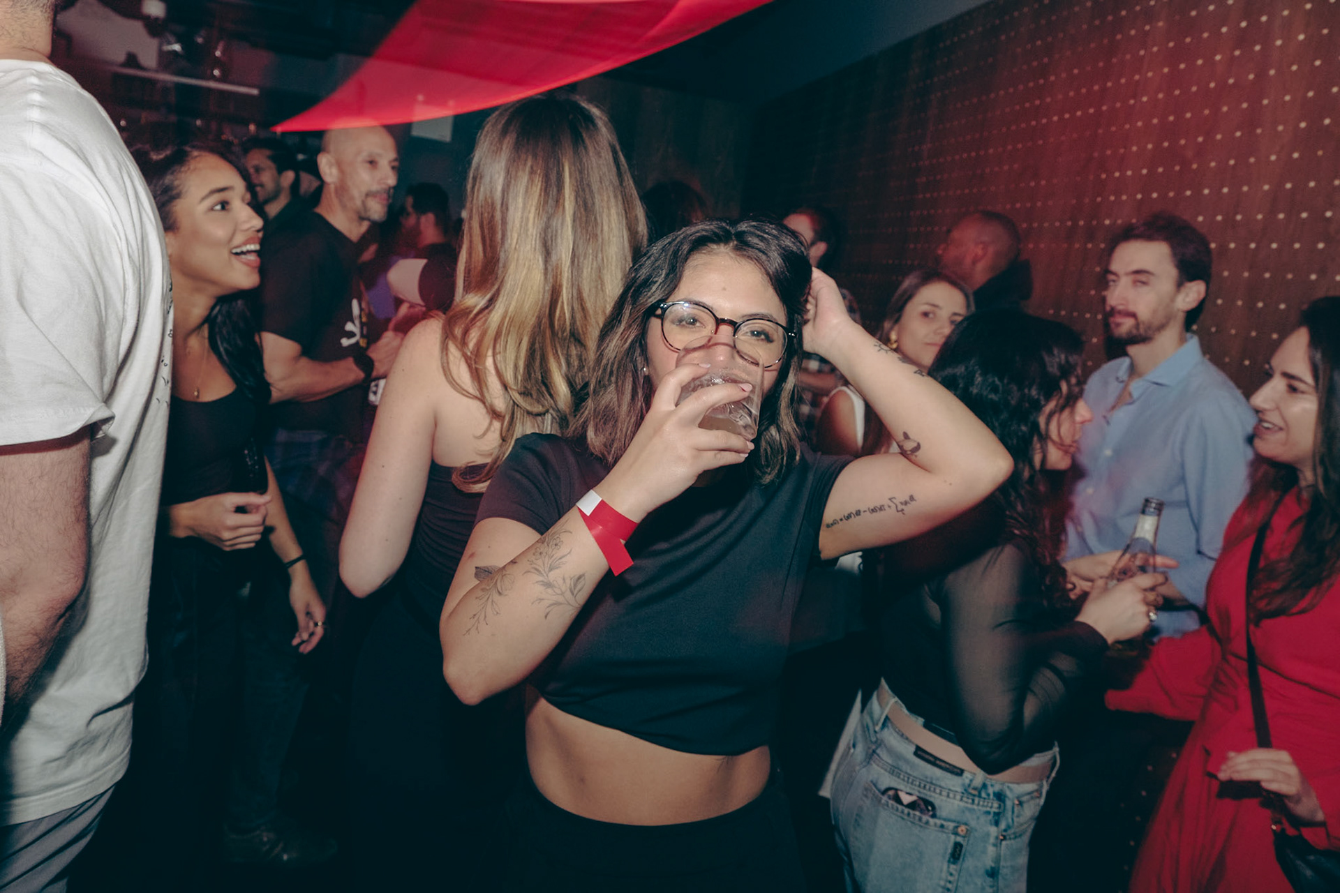 Explore Toronto’s nightlife through close-up shots and the glow of drag flash effects at Rumba Buena’s unforgettable party scene.