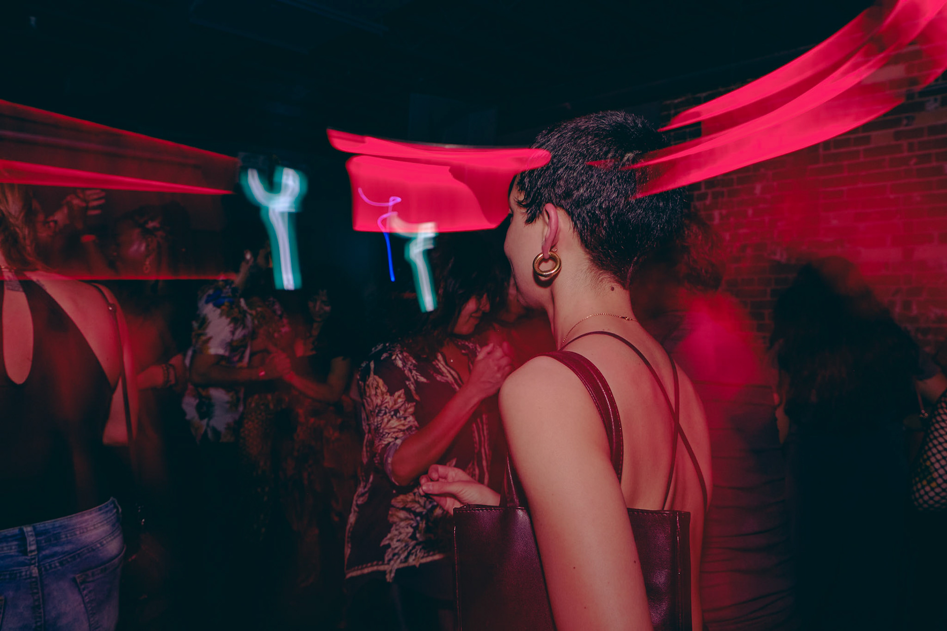 Explore Toronto’s nightlife through close-up shots and the glow of drag flash effects at Rumba Buena’s unforgettable party scene.