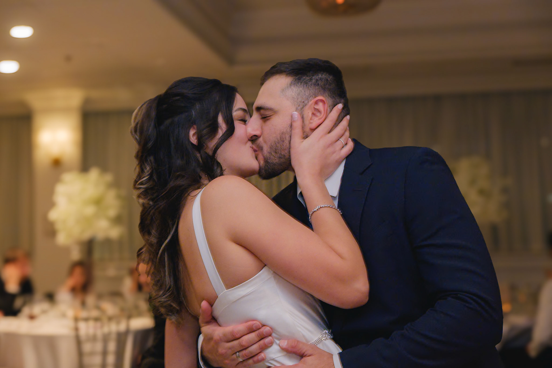 Romantic kiss shared by the engaged couple on the dance floor, captured at a Toronto engagement party