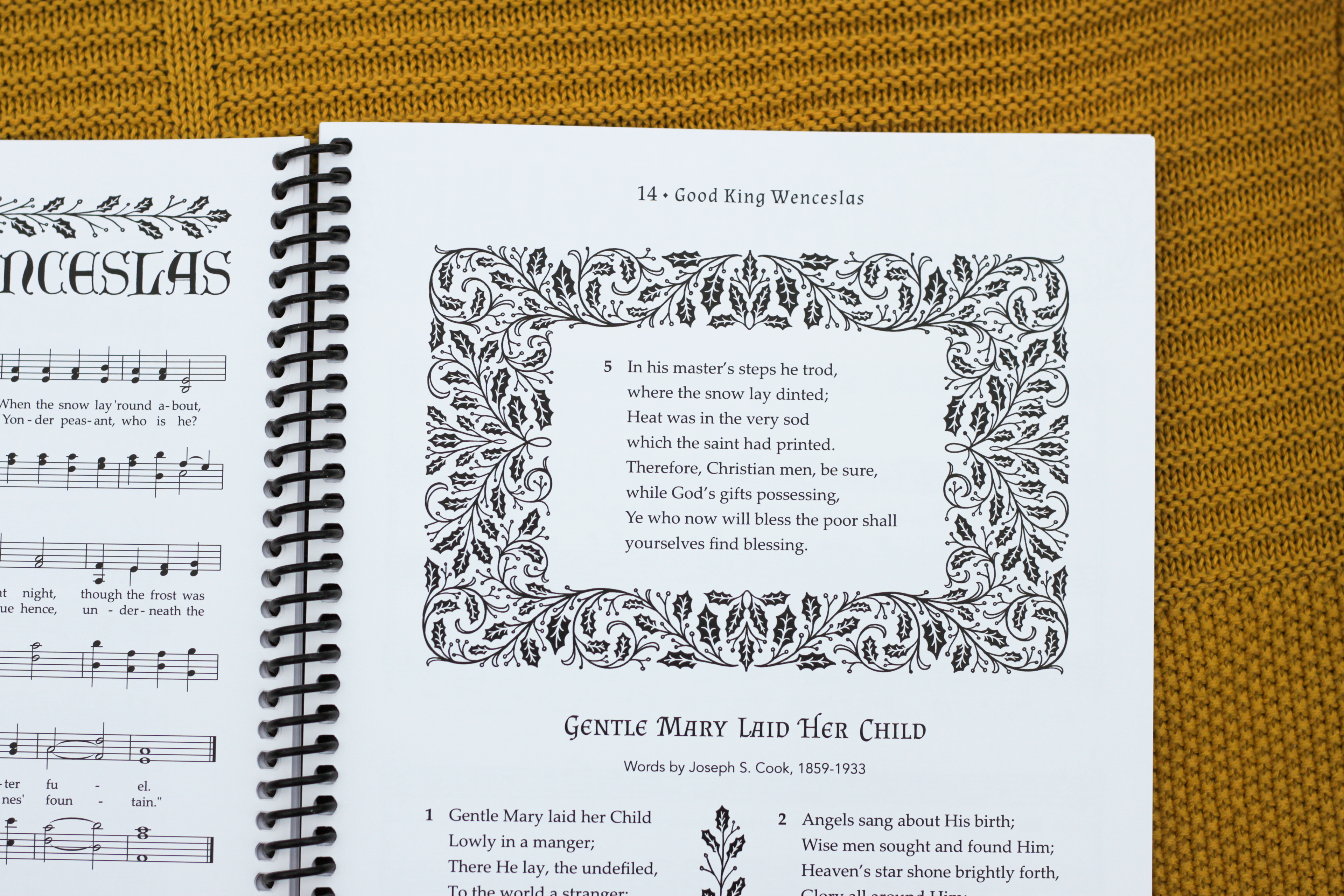 the facing page of "Good King Wenceslas" is illustrated with twining holly motifs and also features alternative lyrics