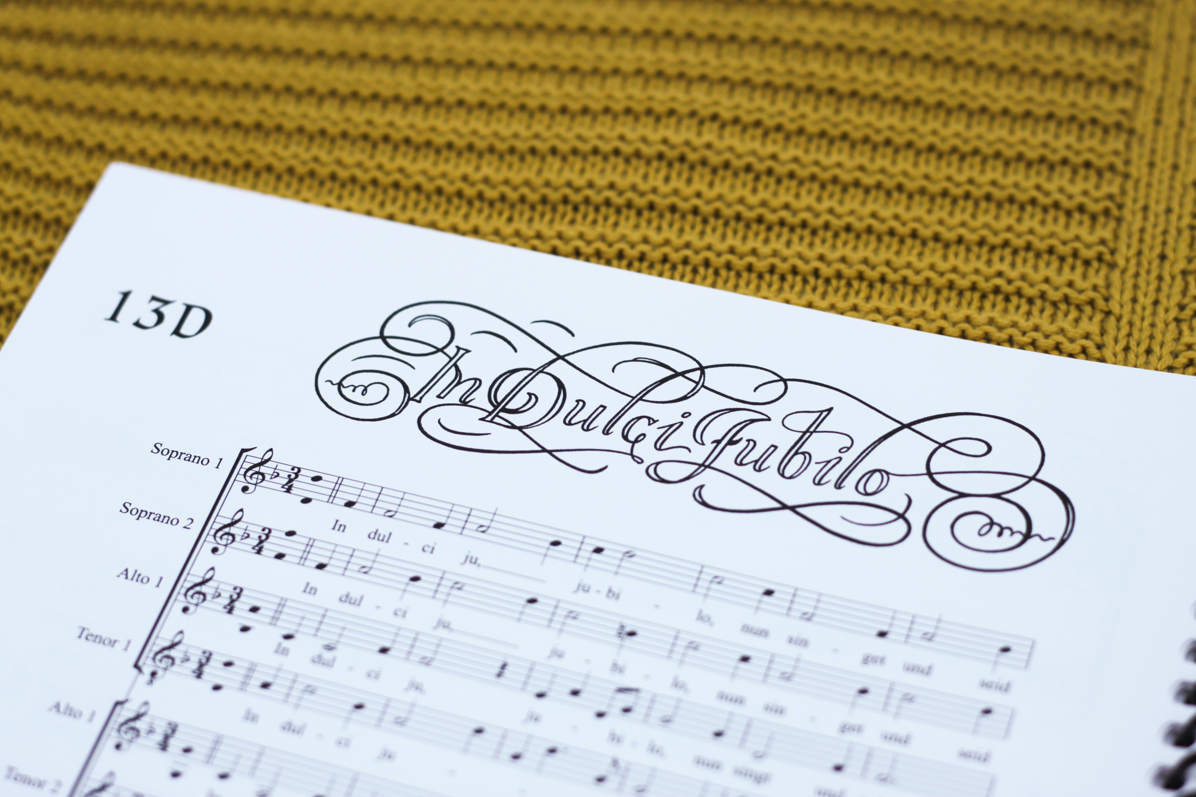 the title treatment for H. Praetorius's 8-setting motet of "In Dulci Jubilo" was inspired by the rich flourishing scripts of the Renaissance