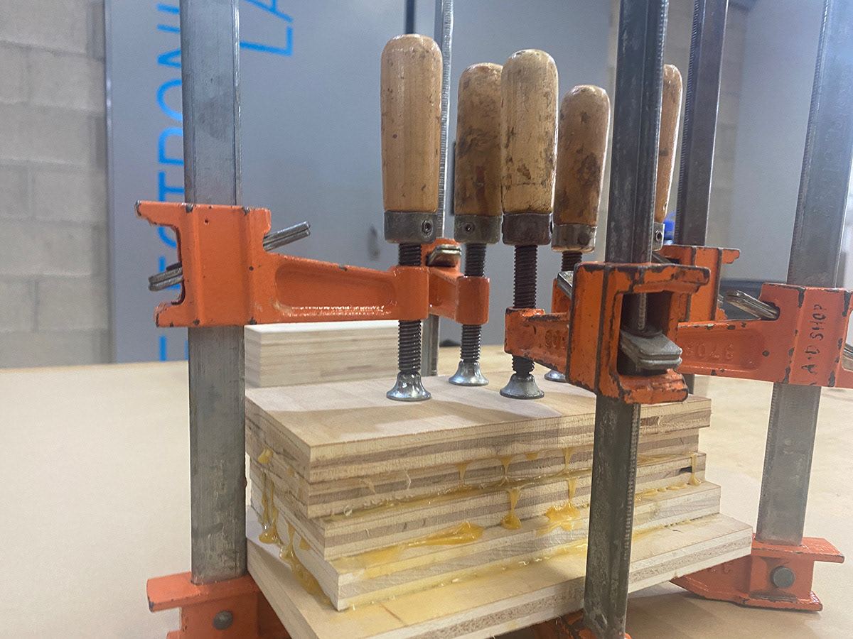 Gluing together scrap wood to make the blank.