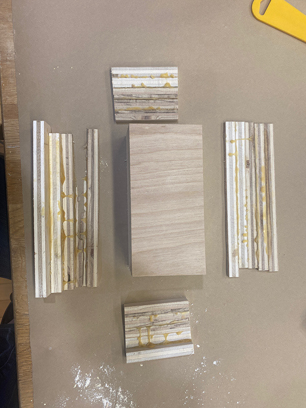 Cutting off the raw edges.