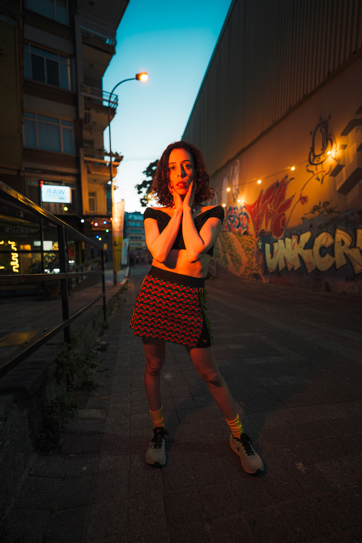 Night street portrait in a colourful patterned skirt on an Istanbul backstreet