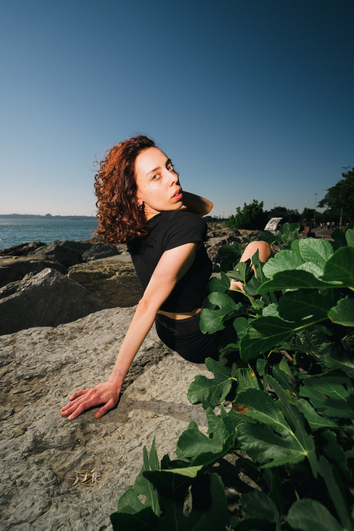 Portrait against green foliage on the Bosphorus waterfront in Istanbul