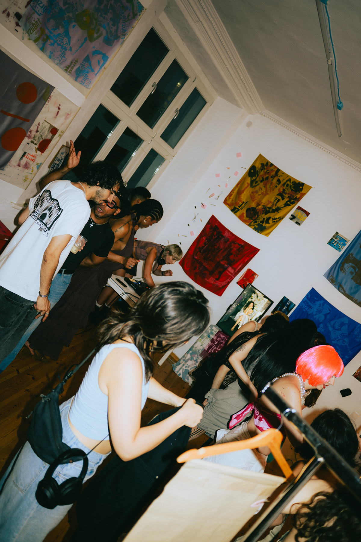 Hair and makeup styling in progress backstage at a Berlin fashion event