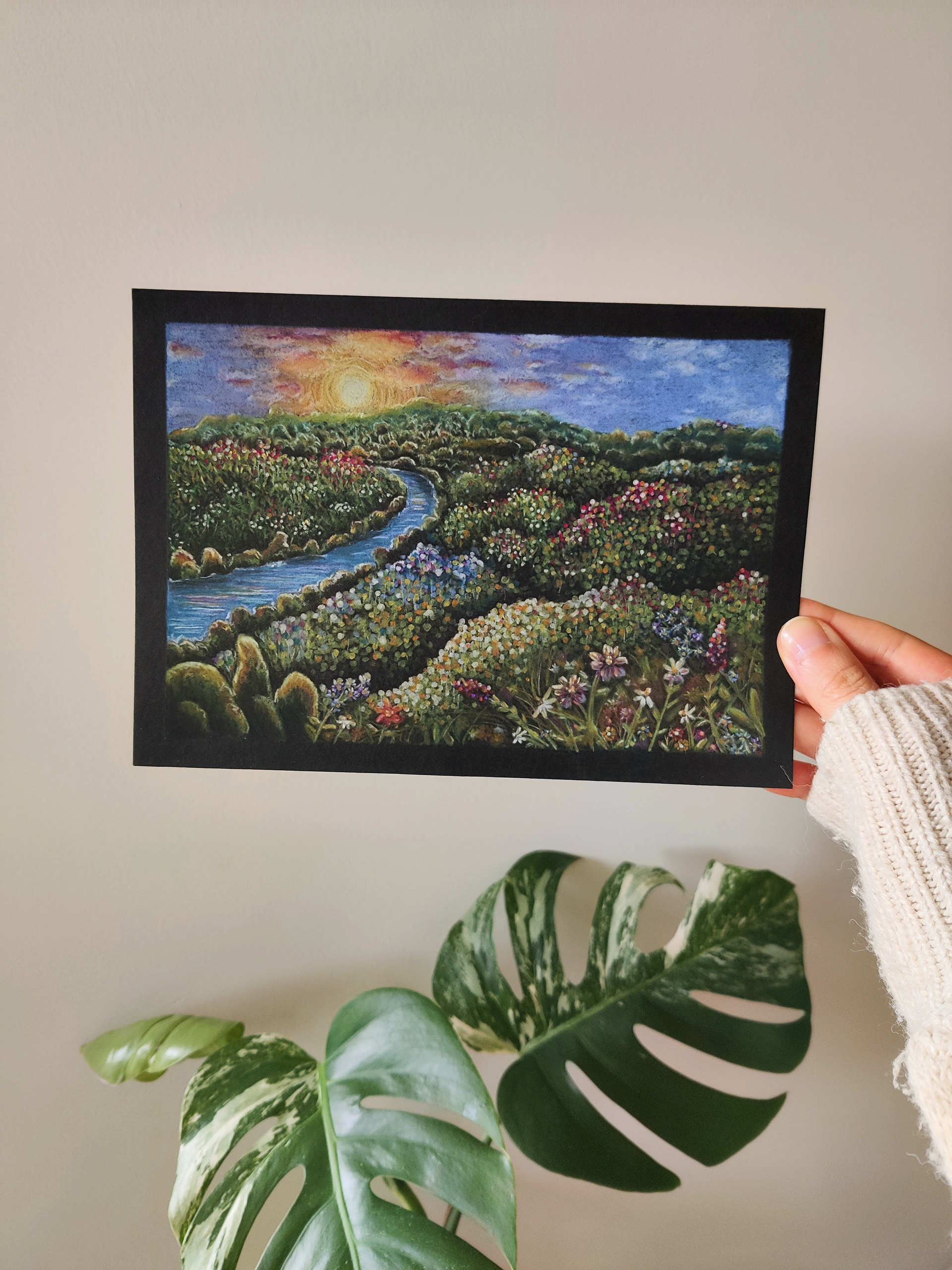 A flower field with river on A5 black paper