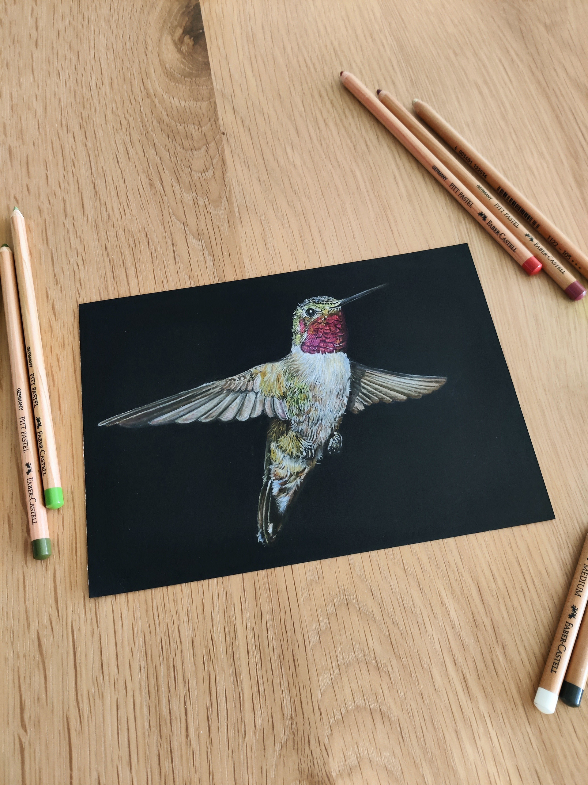 A hummingbird on A5 black paper