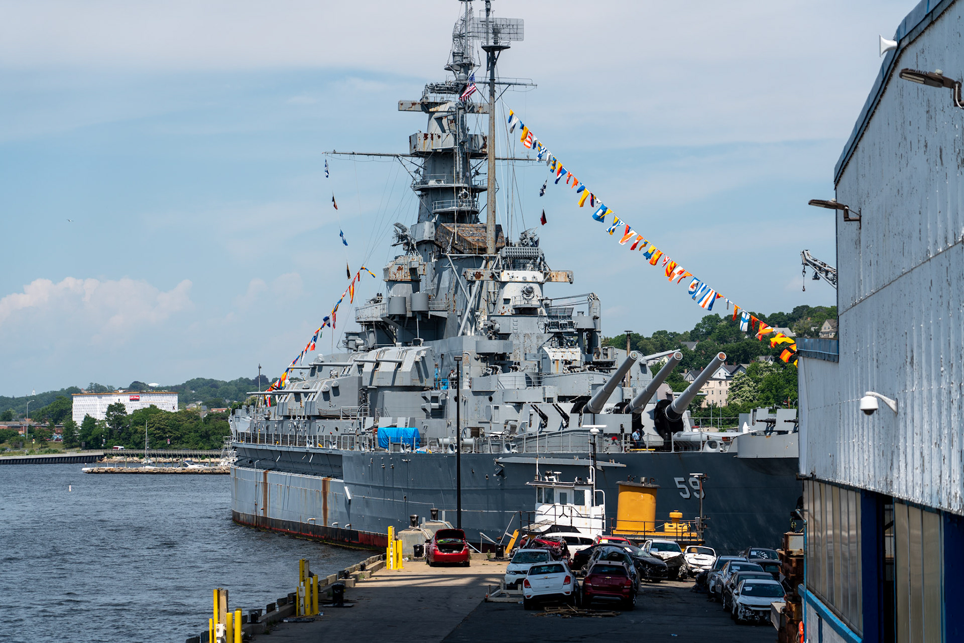 USS Massachusetts (BB-59) is the third of four South Dakota-class fast battleships built for the United States Navy in the late 1930s. The first American battleships designed after the Washington treaty system began to break down in the mid-1930s, they took advantage of an escalator clause that allowed increasing the main battery to 16-inch (406 mm) guns, but refusal to authorize larger battleships kept their displacement close to the Washington limit of 35,000 long tons (36,000 t). A requirement to be armored against the same caliber of guns as they carried, combined with the displacement restriction, resulted in cramped ships, a problem that was exacerbated by wartime modifications that considerably strengthened their anti-aircraft batteries and significantly increased their crews.