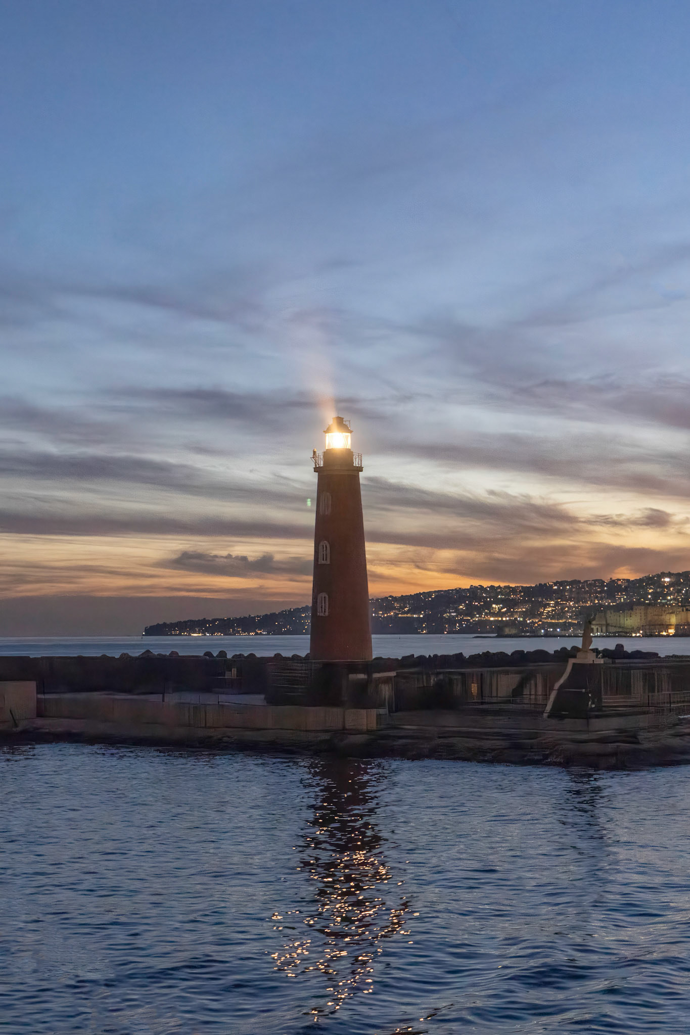 Lighthouse entering Naples harbor