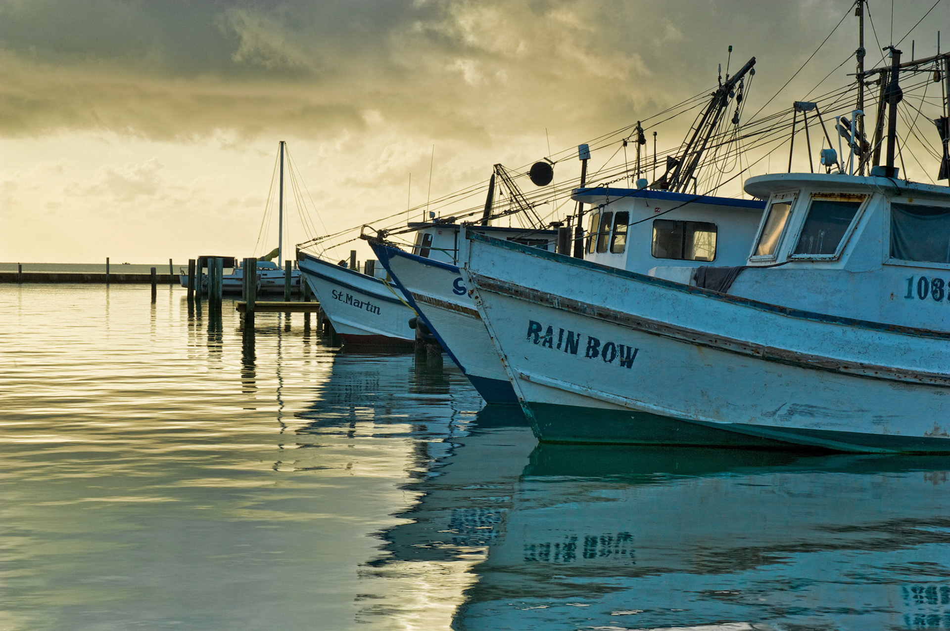 These boat lay quietly in port, ready to go where their masters direct them. I wonder what adventures await them on their next journey.
