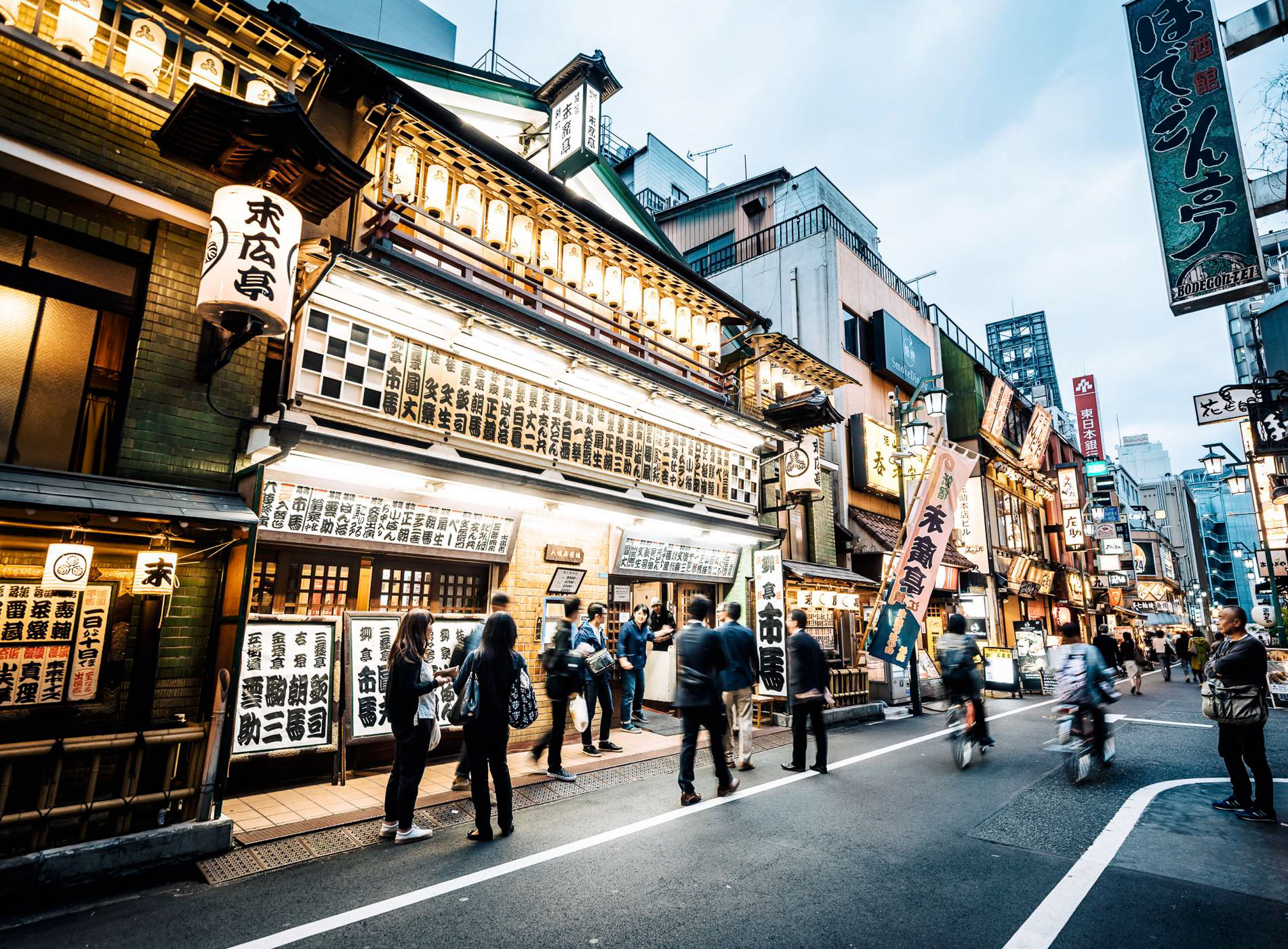 The lights and traditional handwritten announcements of Suehirotei theatre, a traditional performance space in Shinjuku's San-chome (3 chome) district, Shinjuku City, Tokyo, Japan