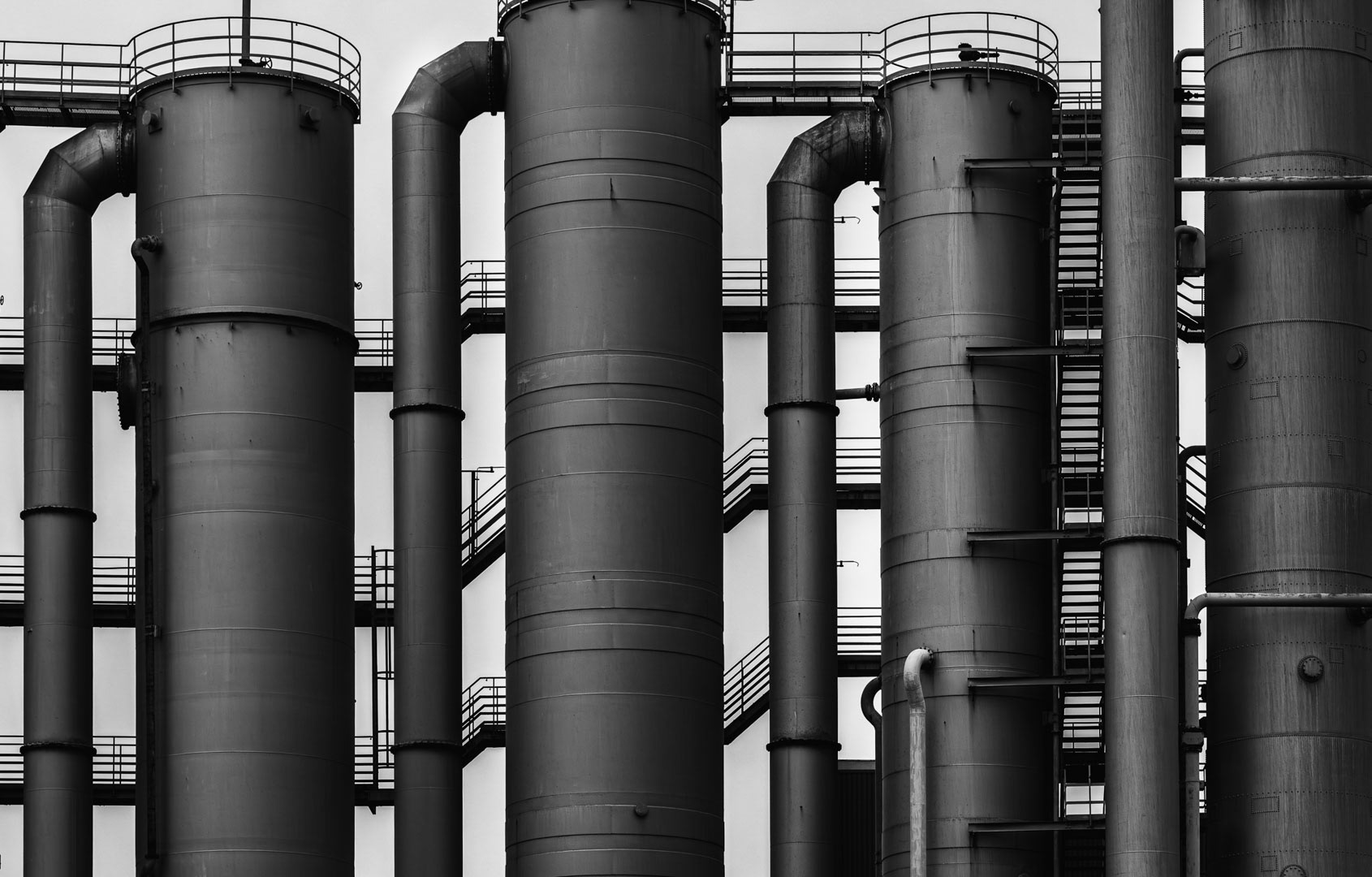 Vertical Rhythm — Factory pipes aligned in minimalist order, Duisburg.