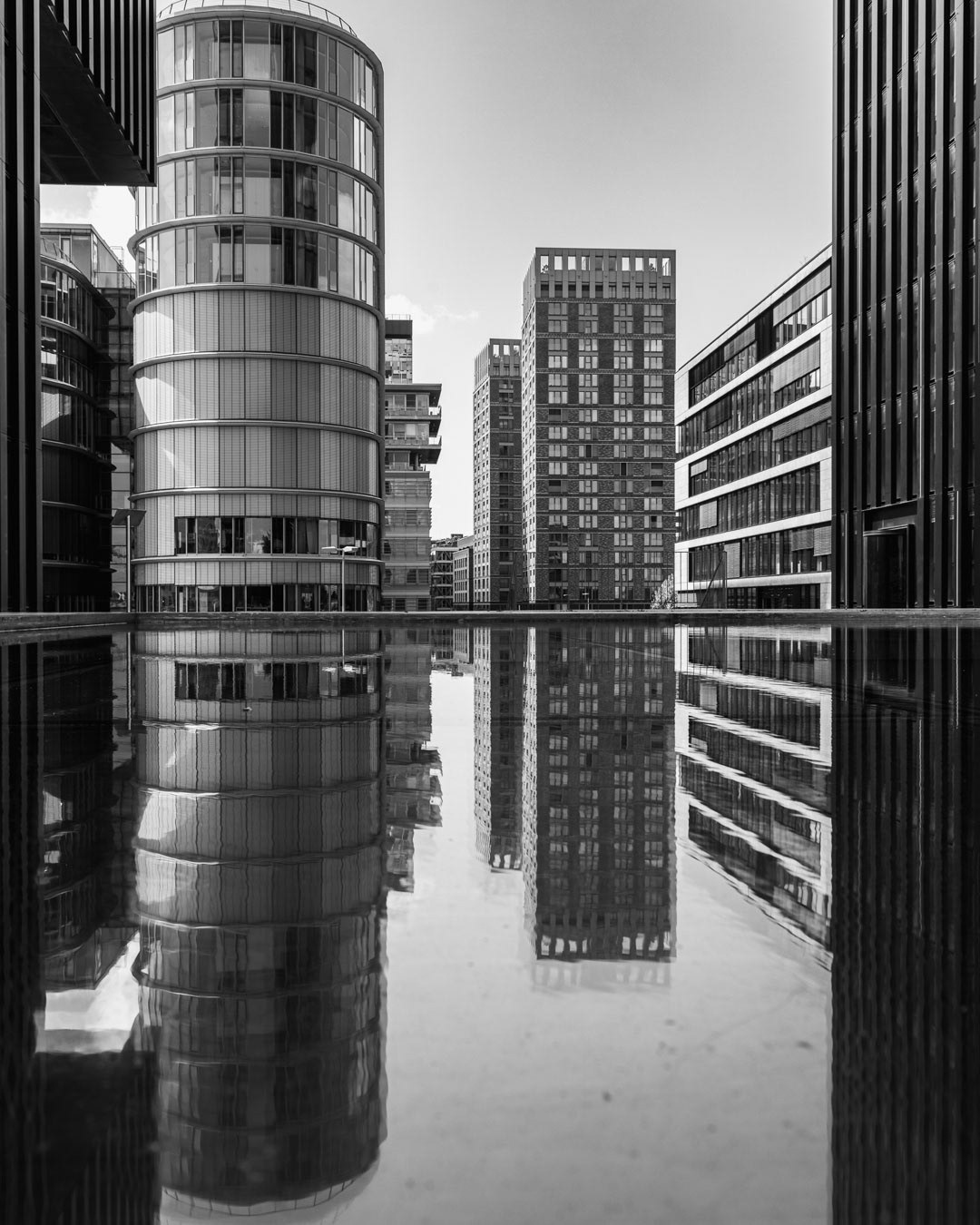 Reflected Order — Glass and steel mirrored in calm symmetry, Düsseldorf.