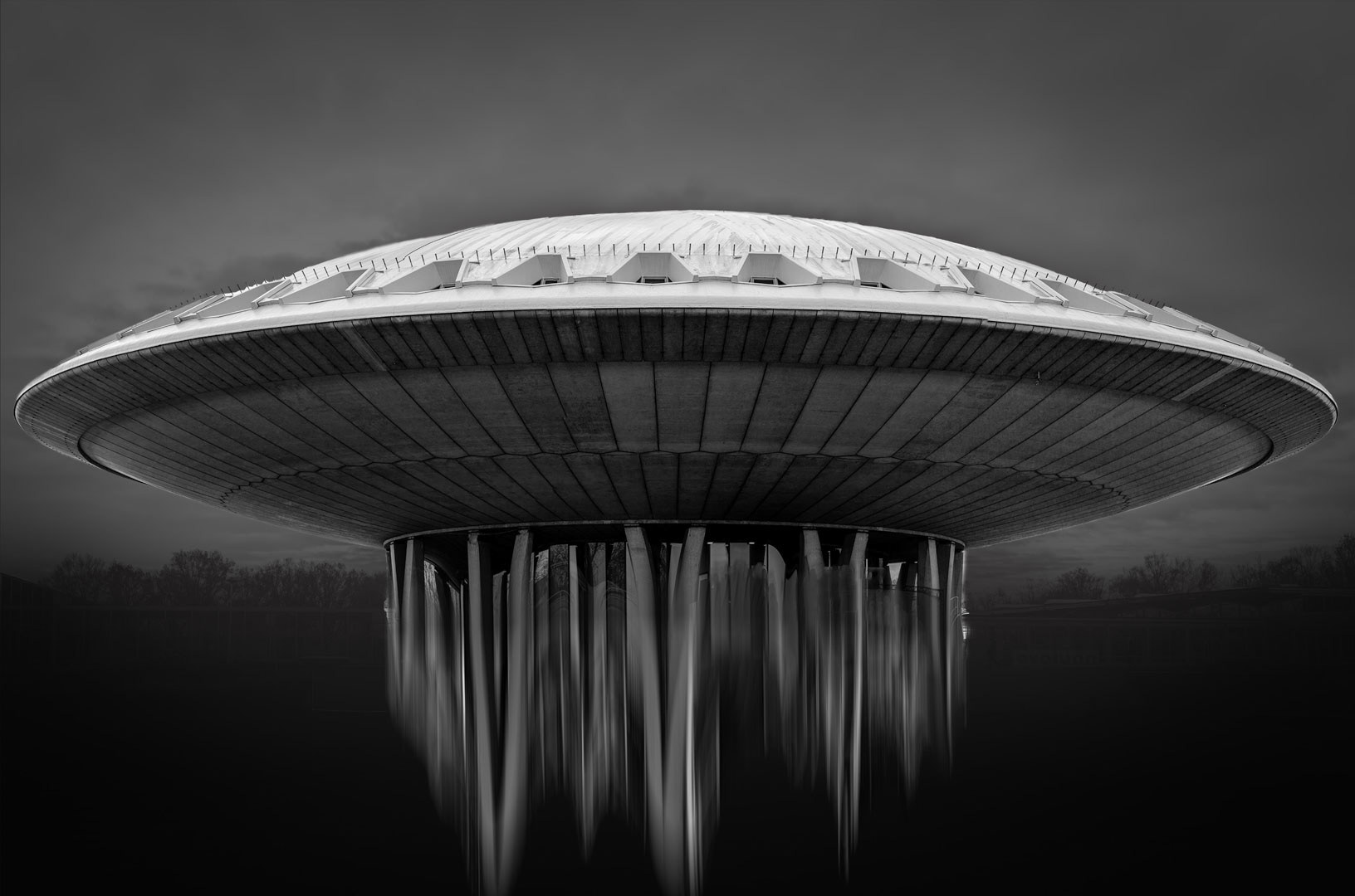 Futuristic Halo — A hovering form over still water, Eindhoven.