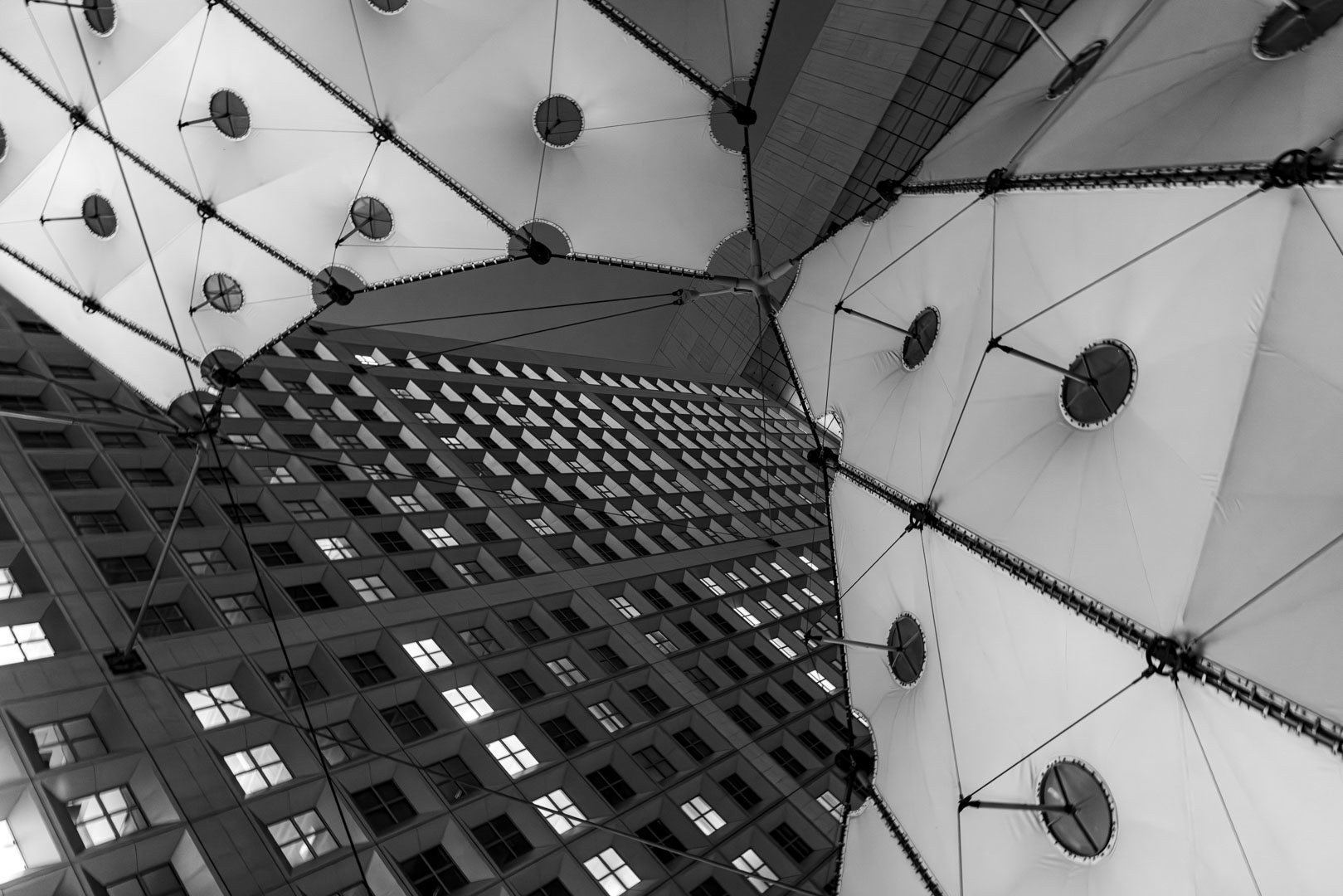 Upward Geometry — Looking through the fabric of a high-rise, Paris.