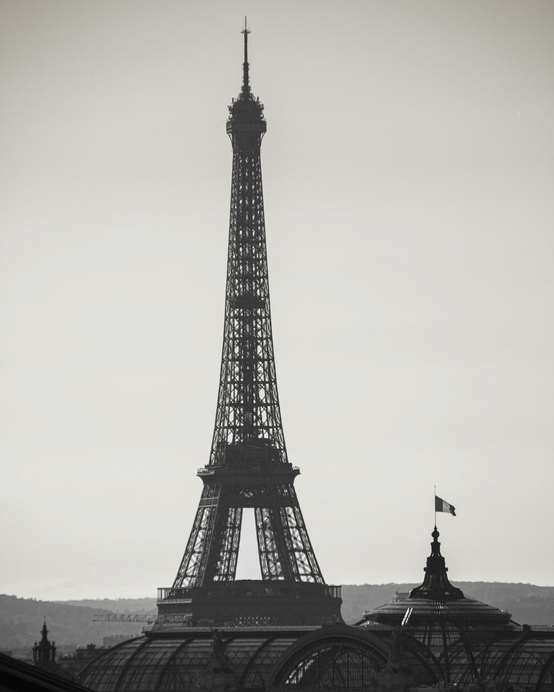 Eiffel Mood — Classic lines beneath a drifting sky, Paris.
