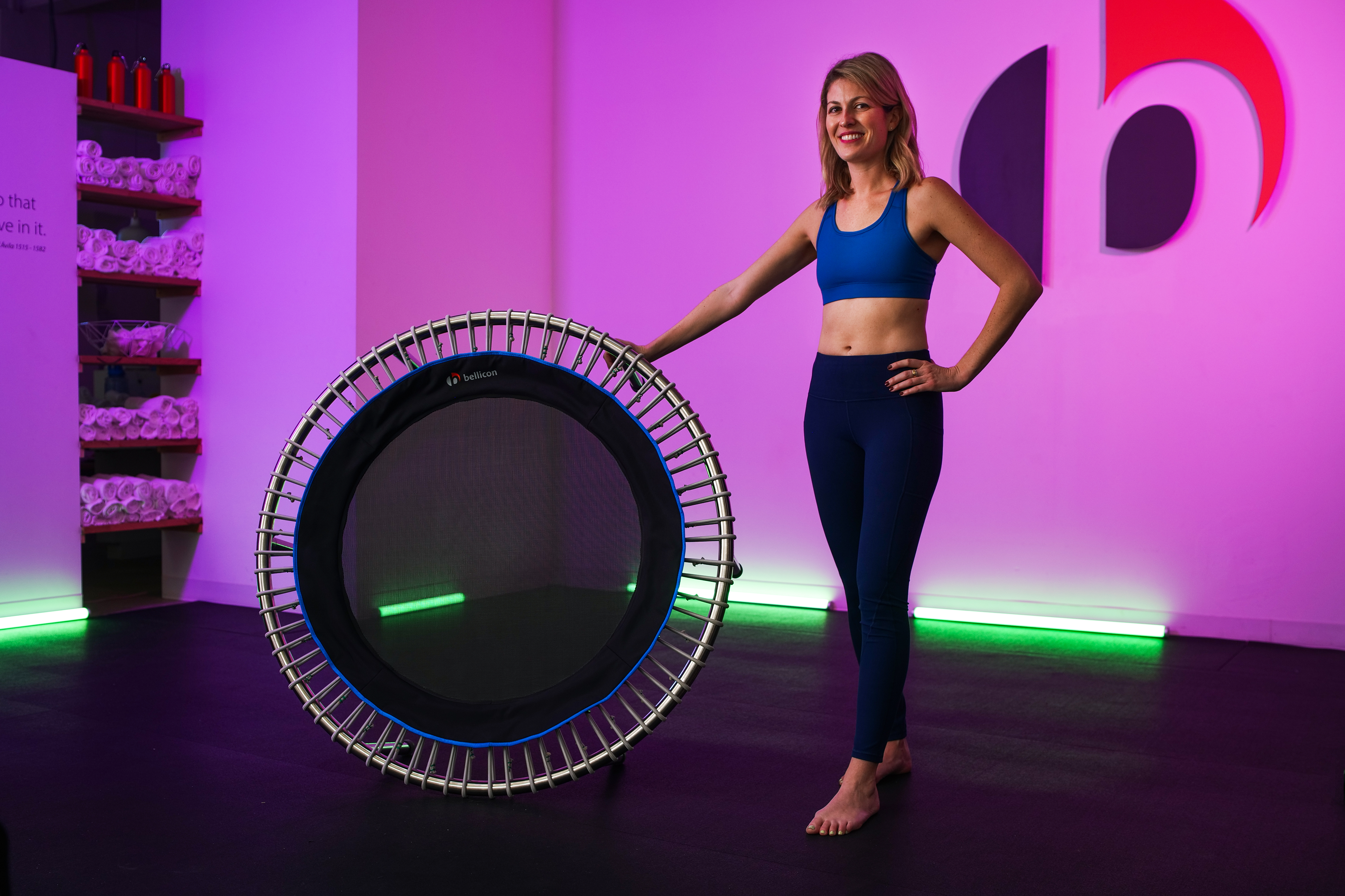 Fitness trainer showing off rebounder.