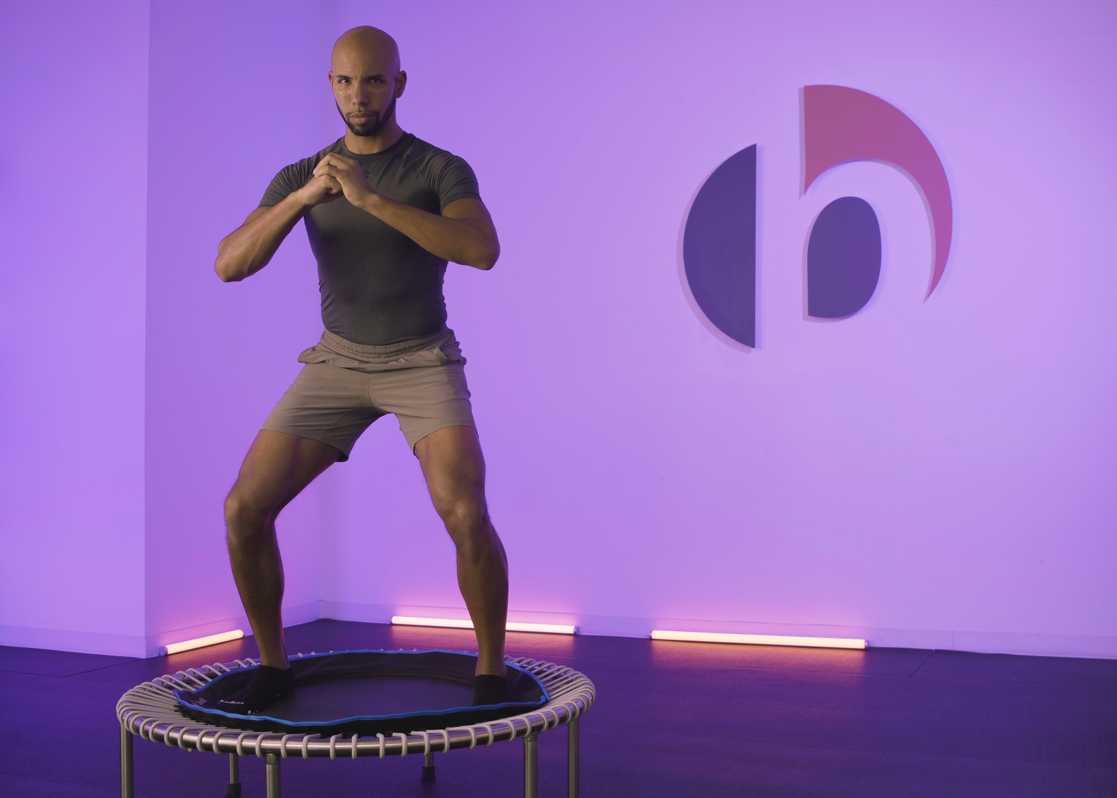 Fitness trainer on rebounder.