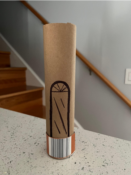 Paper tube depicting sliding glass door for an entrance.