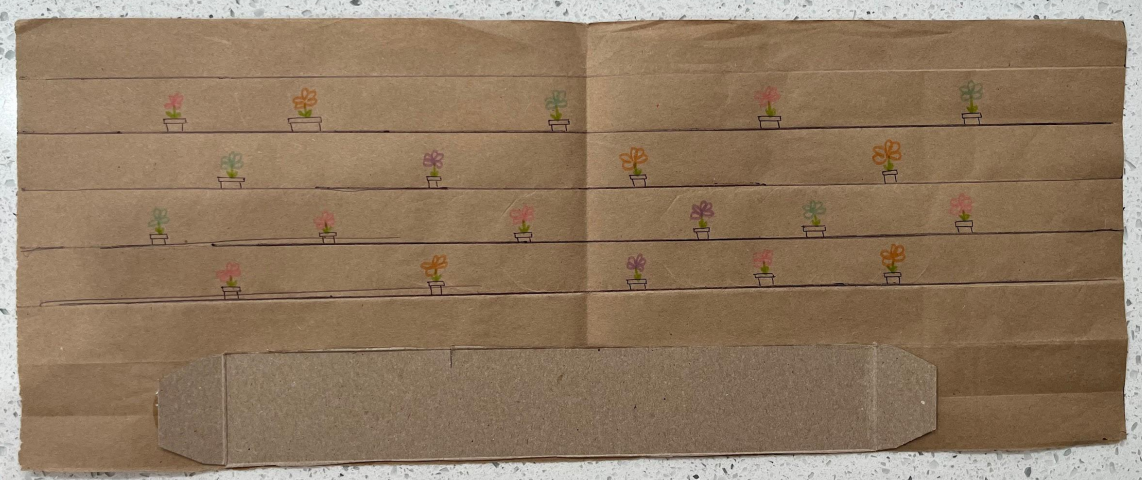 Paper wall lined with a strip of cardboard for support.