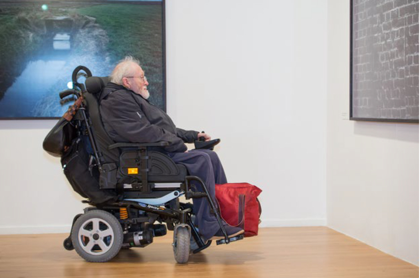 Visitor views 'Shot at Dawn' by Chloe Dewe Mathews © Impressions Gallery