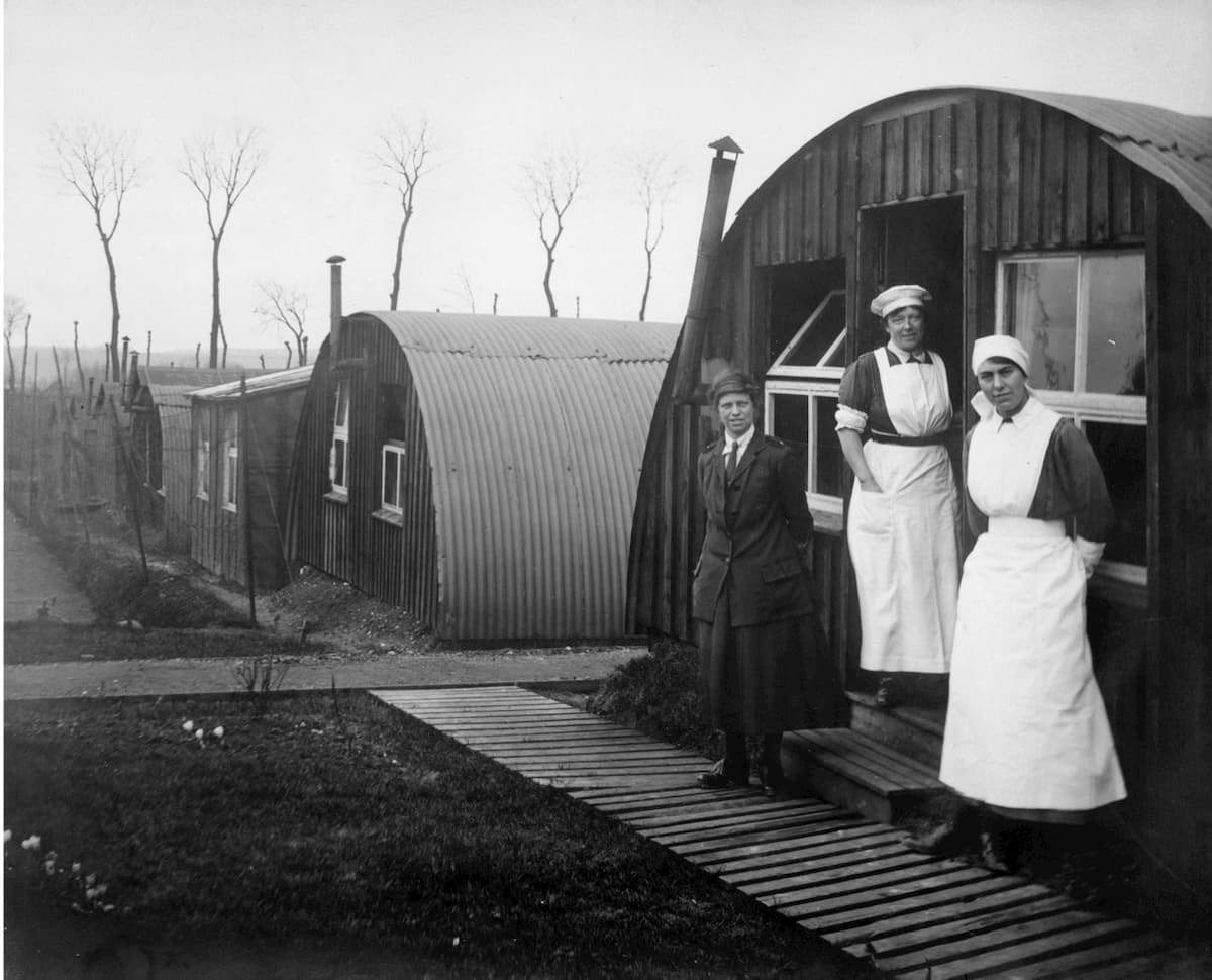 Commandant Johnson and two other women of the General Service Voluntary Aid Detachment (VAD) Motor Convoy outside Nissen Huts, Abbeville, France, 1919 © IWM (Q 8036)