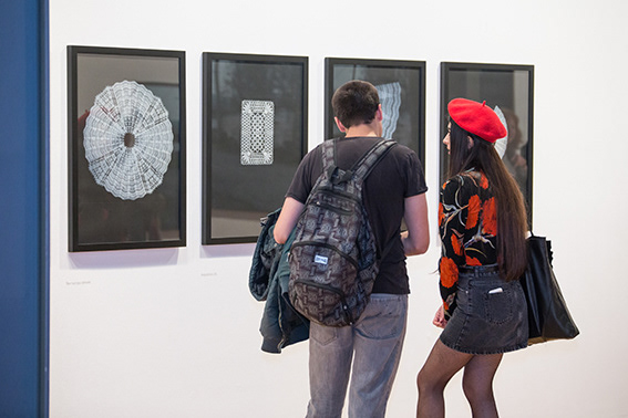 Visitors view 'Reading Between the Lines' (2009—) by Dawn Cole © Impressions Gallery