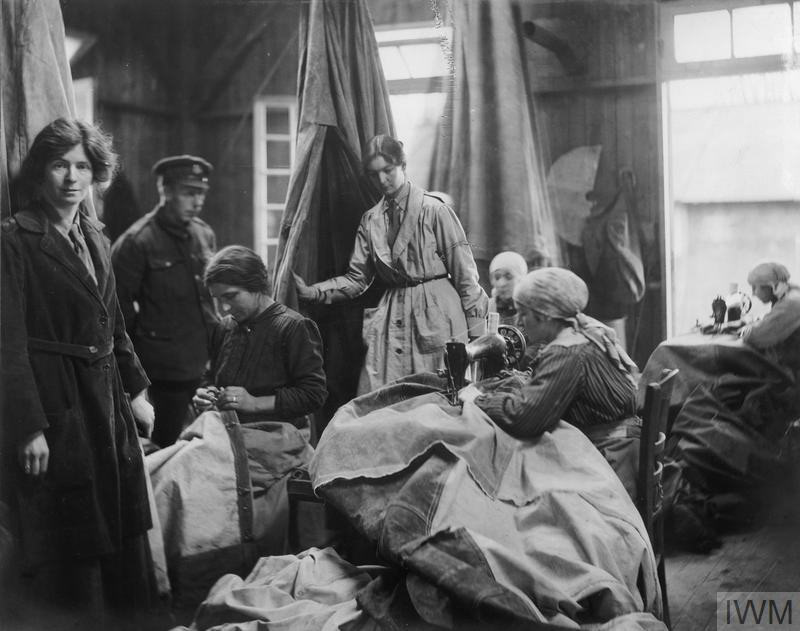 French civilian women repairing tents, No. 8 Ordnance Depot, Abbeville, 1919. Photograph by Olive Edis © IWM (Q 8046)
