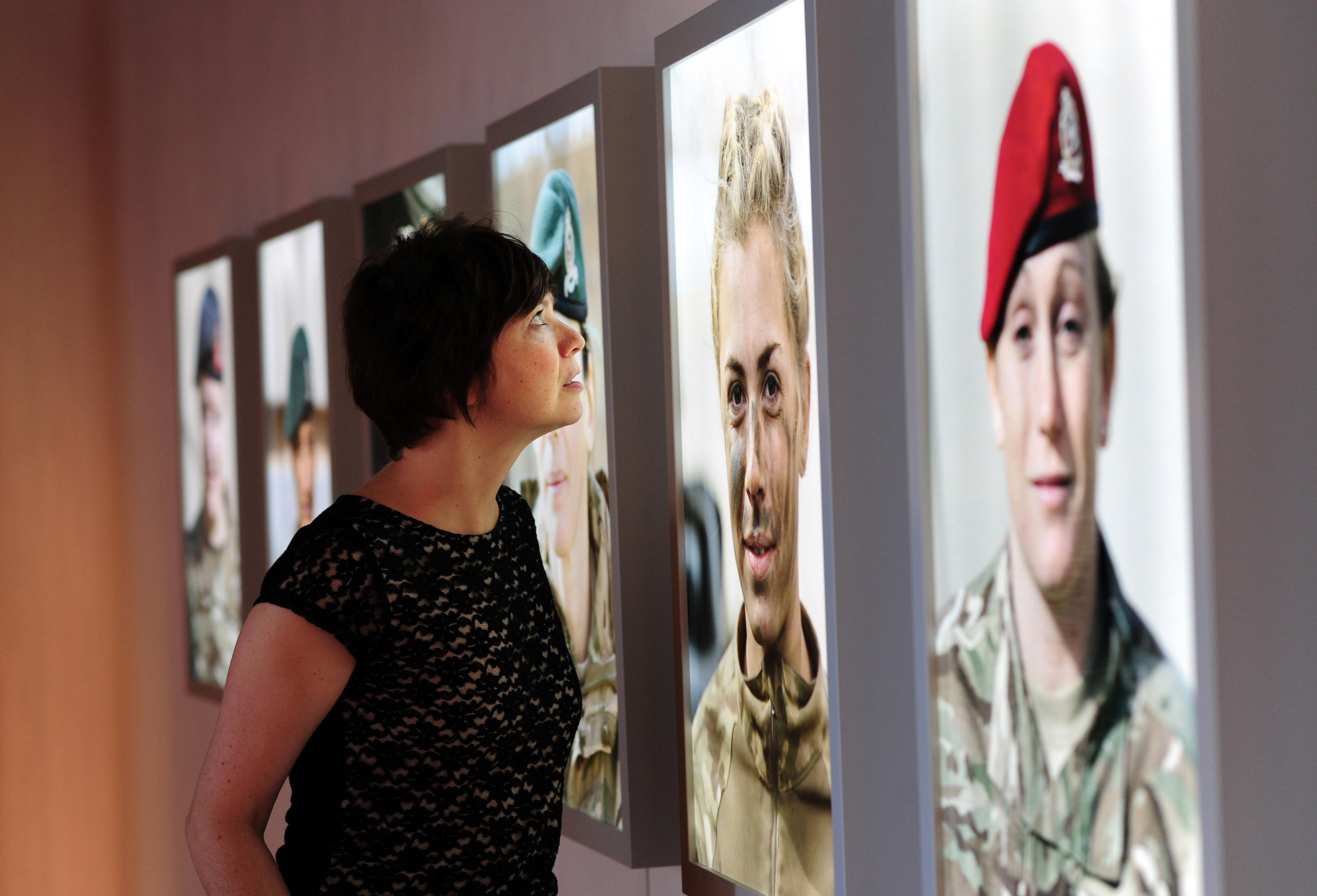 Curator Pippa Oldfield views 'Soldier' (2011-2016) by Alison Baskerville © Impressions Gallery