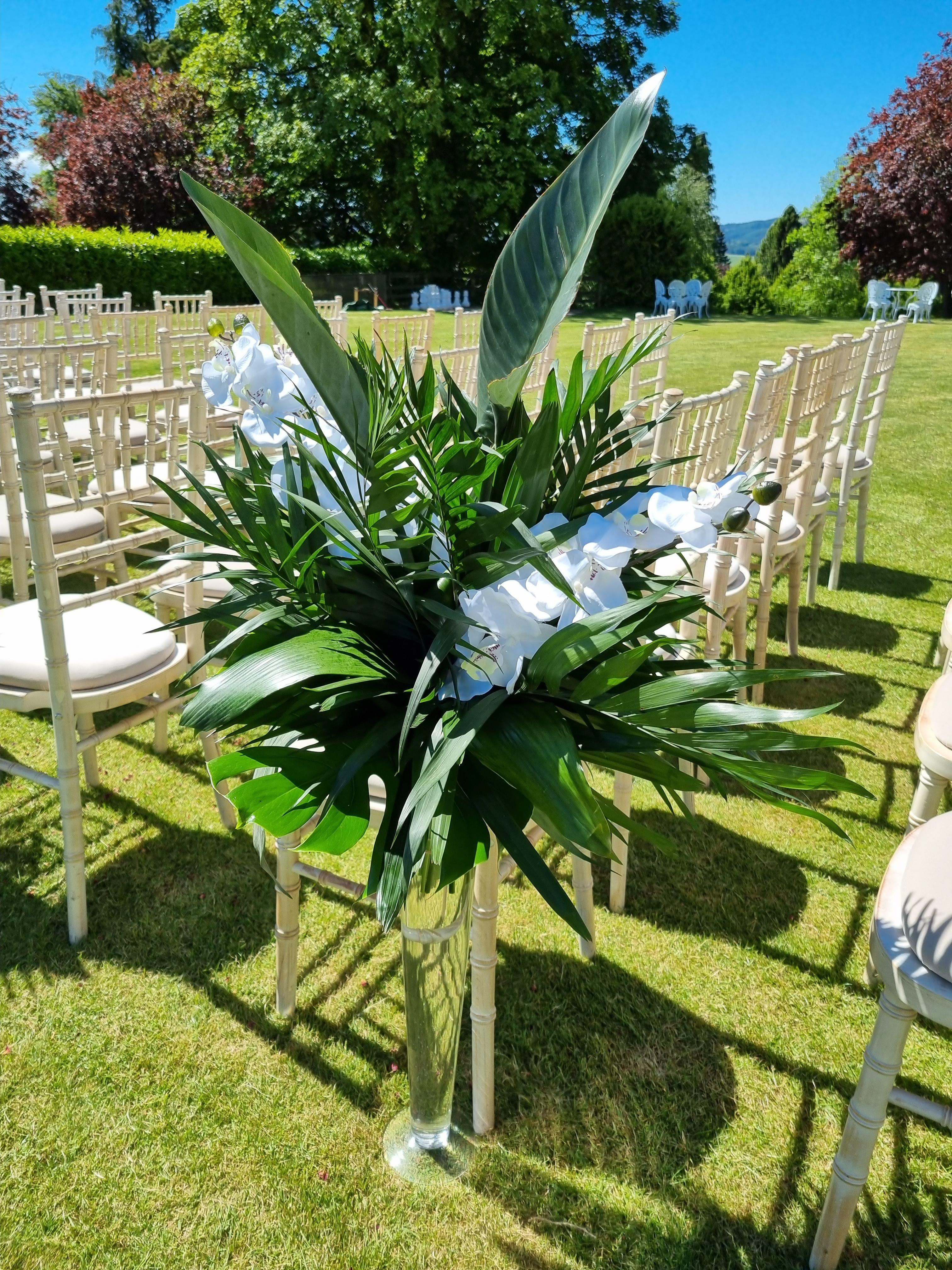 tropical centrepiece of white phalaenopsis & tropical leavess