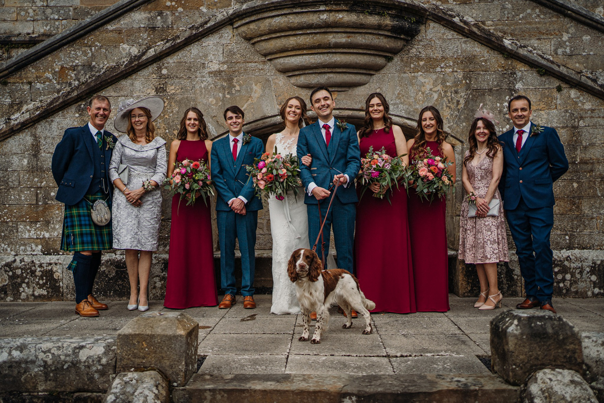 wedding party with autumnal wedding flowers